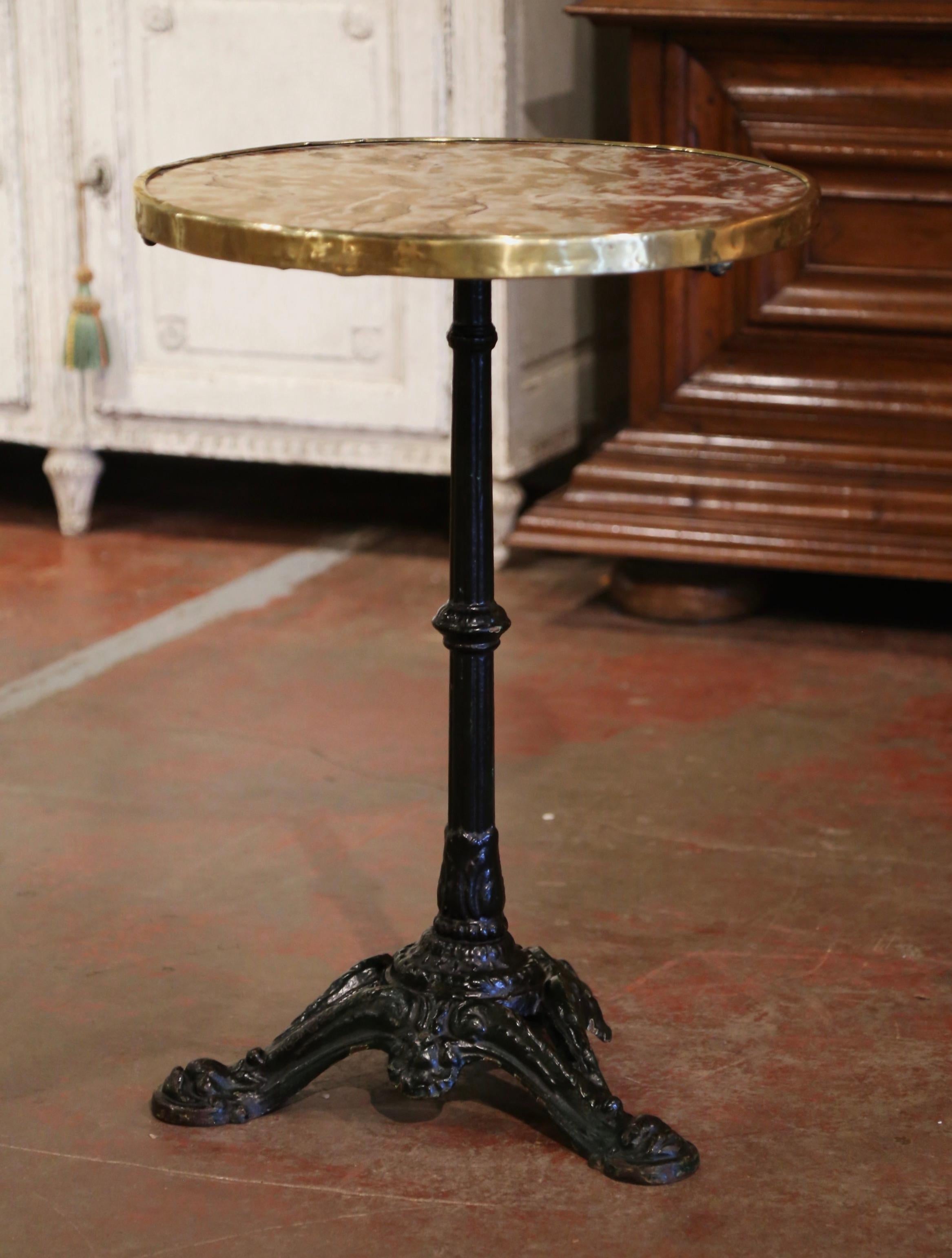 This exquisite, antique gueridon was crafted in Paris, France, circa 1870. The intricate base sits on three paw feet decorated over a carved stem embellished with acanthus leaf motifs. The Classic bistrot table is dressed with the original