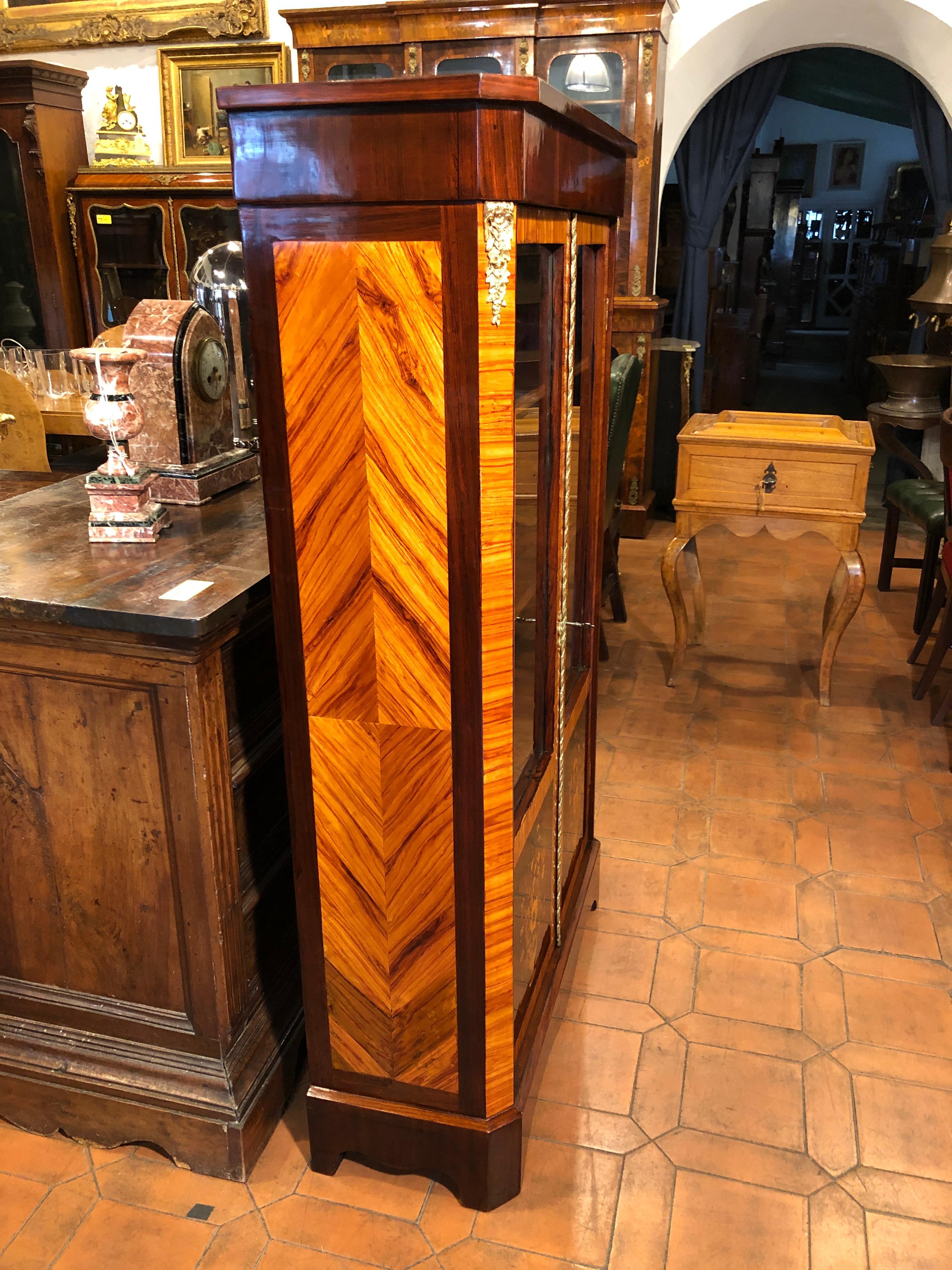 Beautiful cabinet from France, two doors, in rosewood, inlaid in fruitwood, application in gilded bronze.  the item was produced around 1860 and It's fully Restored.