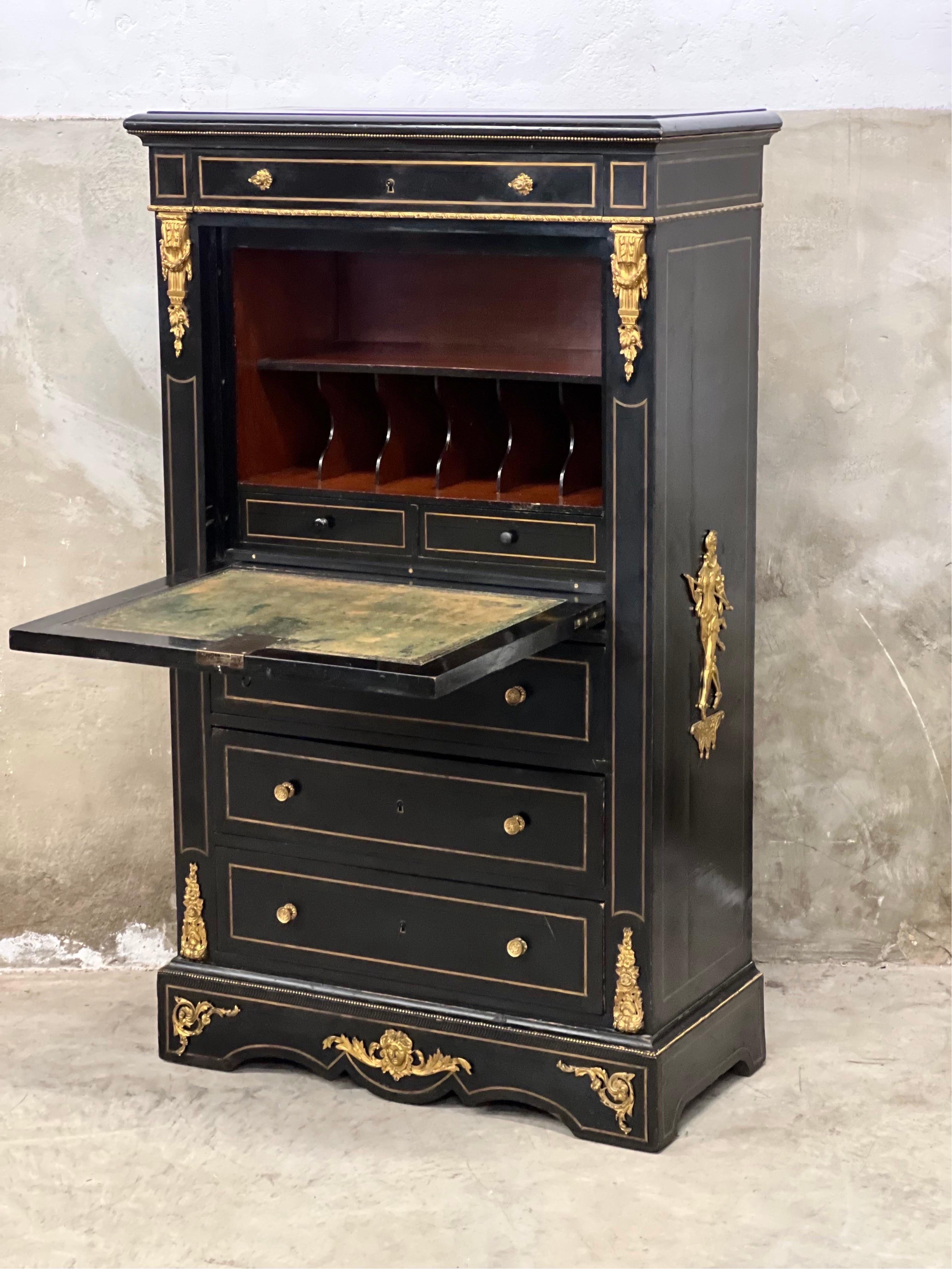 Napoleon III Secretaire á Abattant designed as a Semainier (7 drawer cabinet: 1 drawer for each day of the week). Approx. 1860-1880 made in France. Or also chest of drawers with desk area in Dutch :-).

Ebonized mahogany which means, this case is