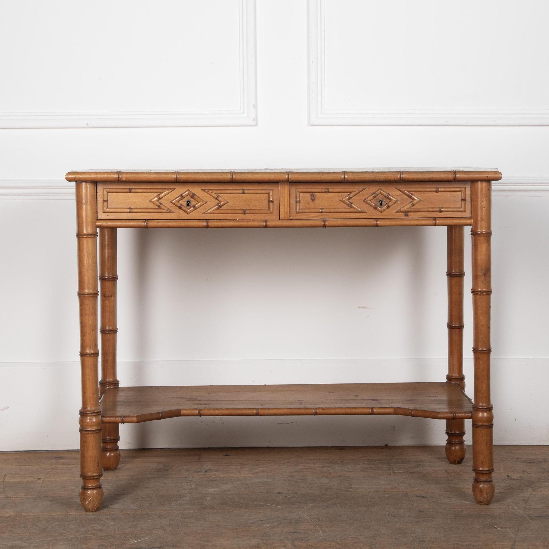 19th Century Napoleon III simulated bamboo console desserte.With two drawers in the frieze decorated with stylised bamboo moulding in the neo-classical taste. The lower tier is wood with a bamboo leading edge. The white marble top is original but
