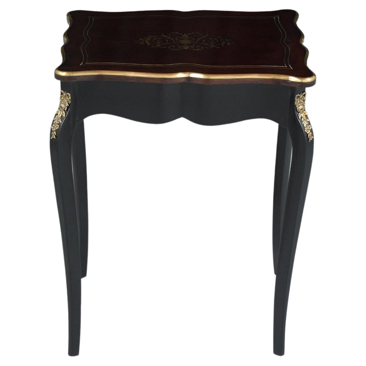 Indulge in the classic charm of French design with our exquisite Napoleon III style side table. Handcrafted by skilled artisans, this piece of furniture is a blend of traditional aesthetics and modern restoration. The wood construction boasts a