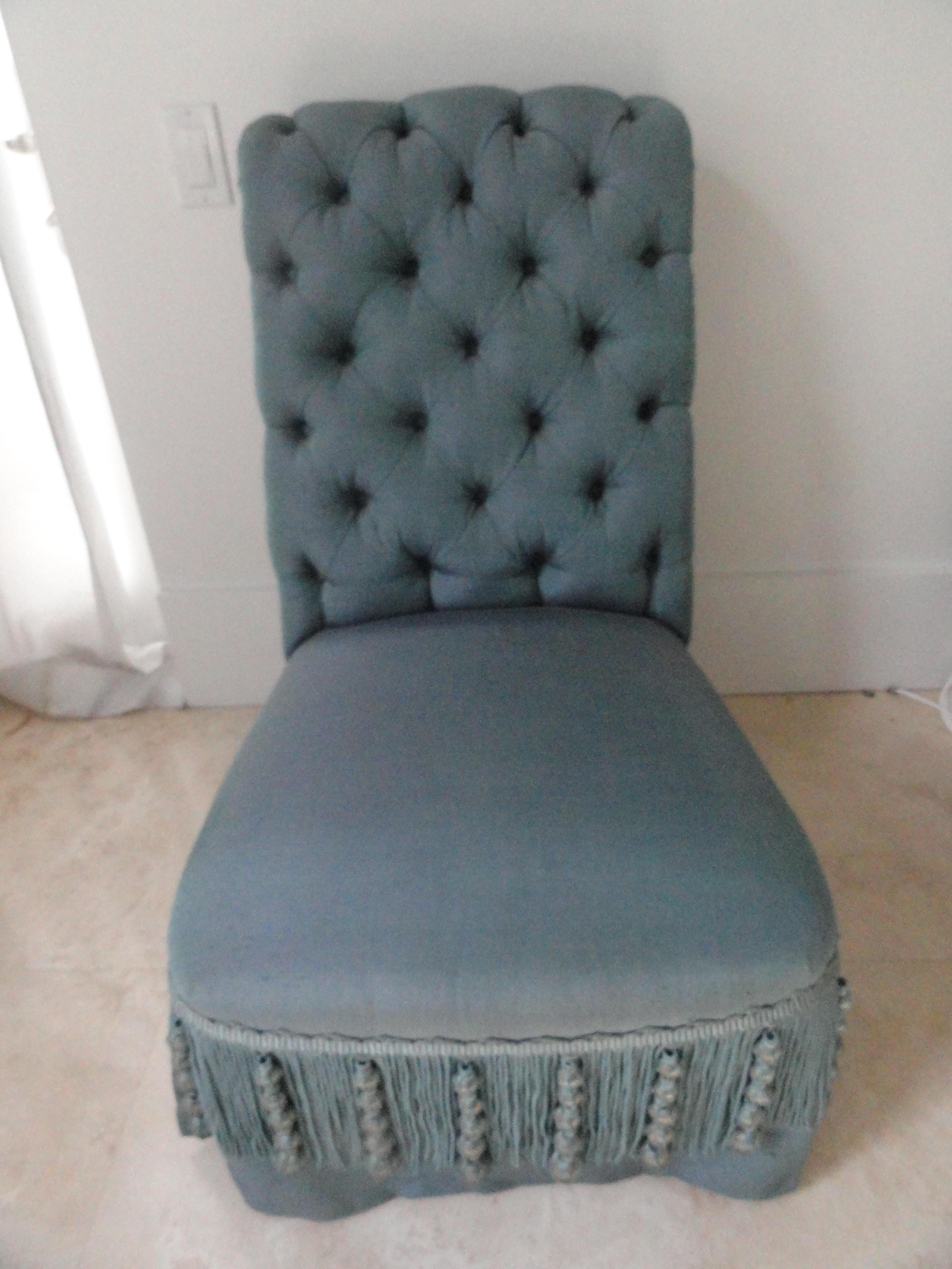 19th century French Napoleon III slipper chair with a tufted back, beautifully upholstered in Henry Calvin Athena Taffeta with a superb decorative fringe. Chair has sabot.