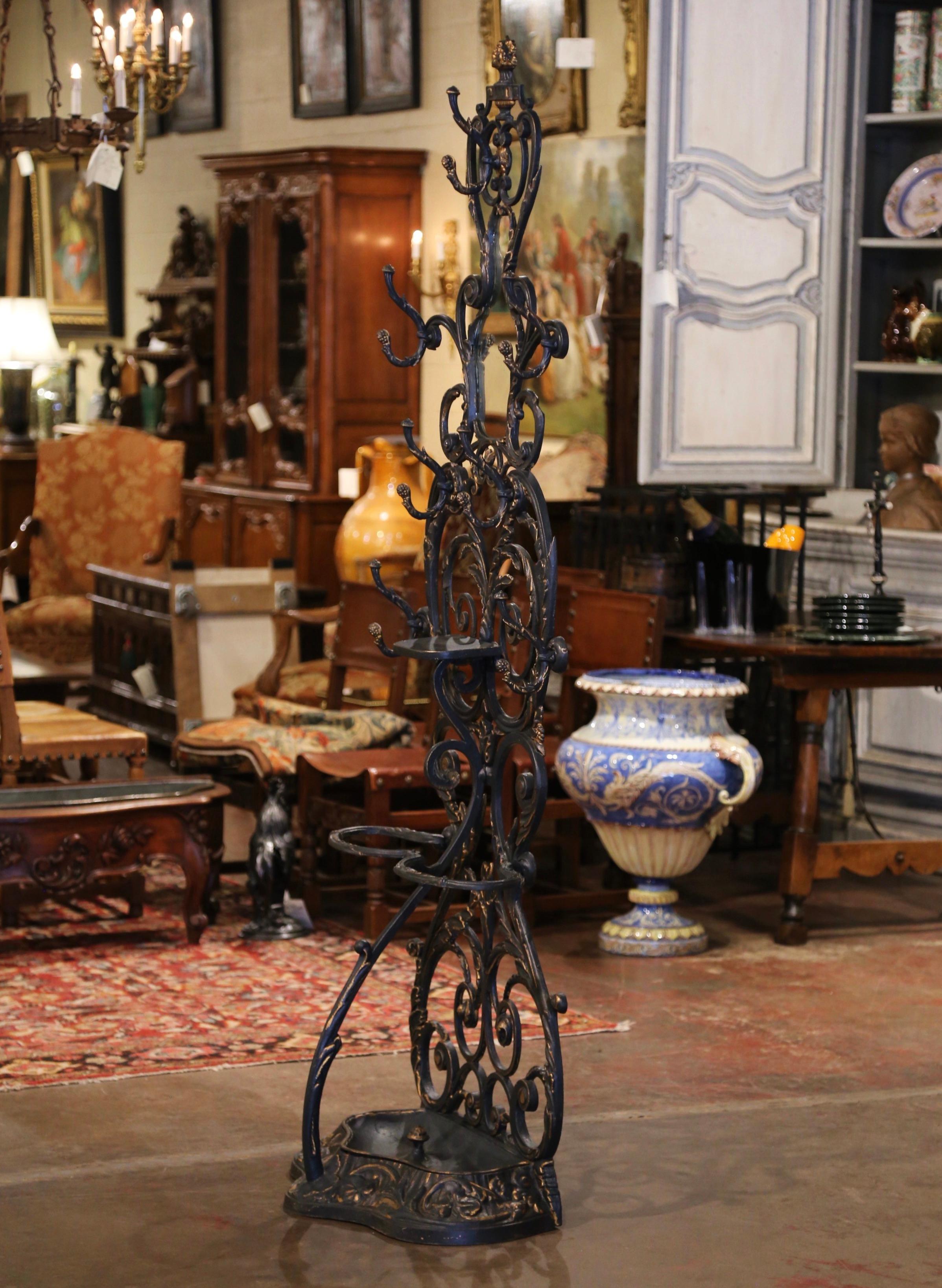 Place this elegant antique hall tree in an entry or a mud room to catch coats, hats and umbrellas. Crafted in France circa 1870, the tall Napoleon III free standing halltree sits on a scalloped base decorated with scroll, floral and acanthus leaf