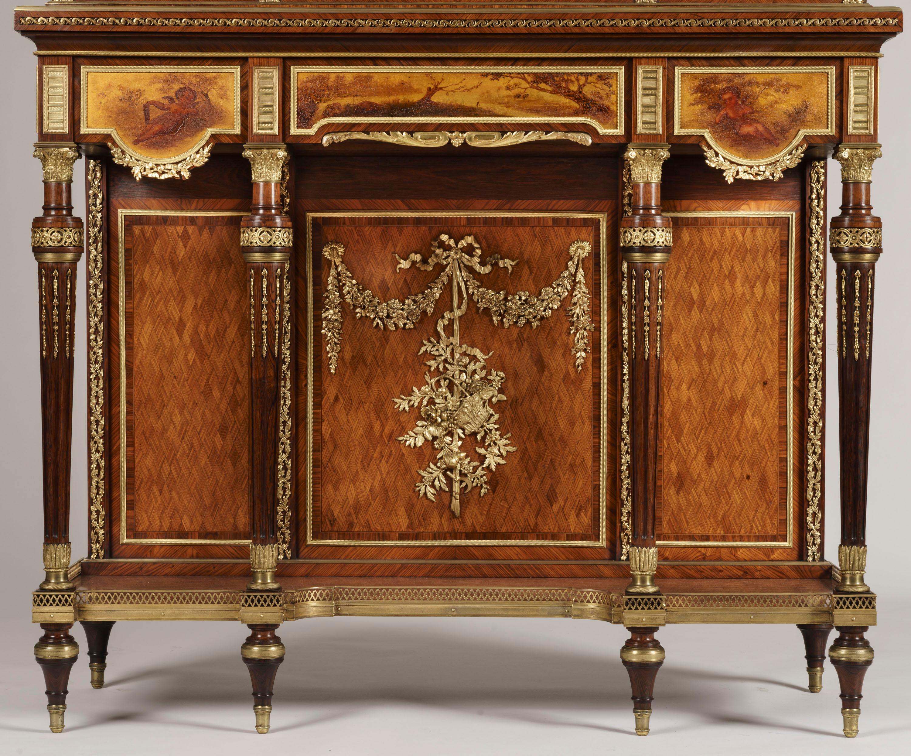 A fine cabinet of the Napoleon III period
Retailed by Grimard of Paris
Almost Certainly by François Linke
 
Constructed in Kingwood and mahogany, with extensive decoration of high quality ormolu work, and Vernis Martin painted doors; of rectangular
