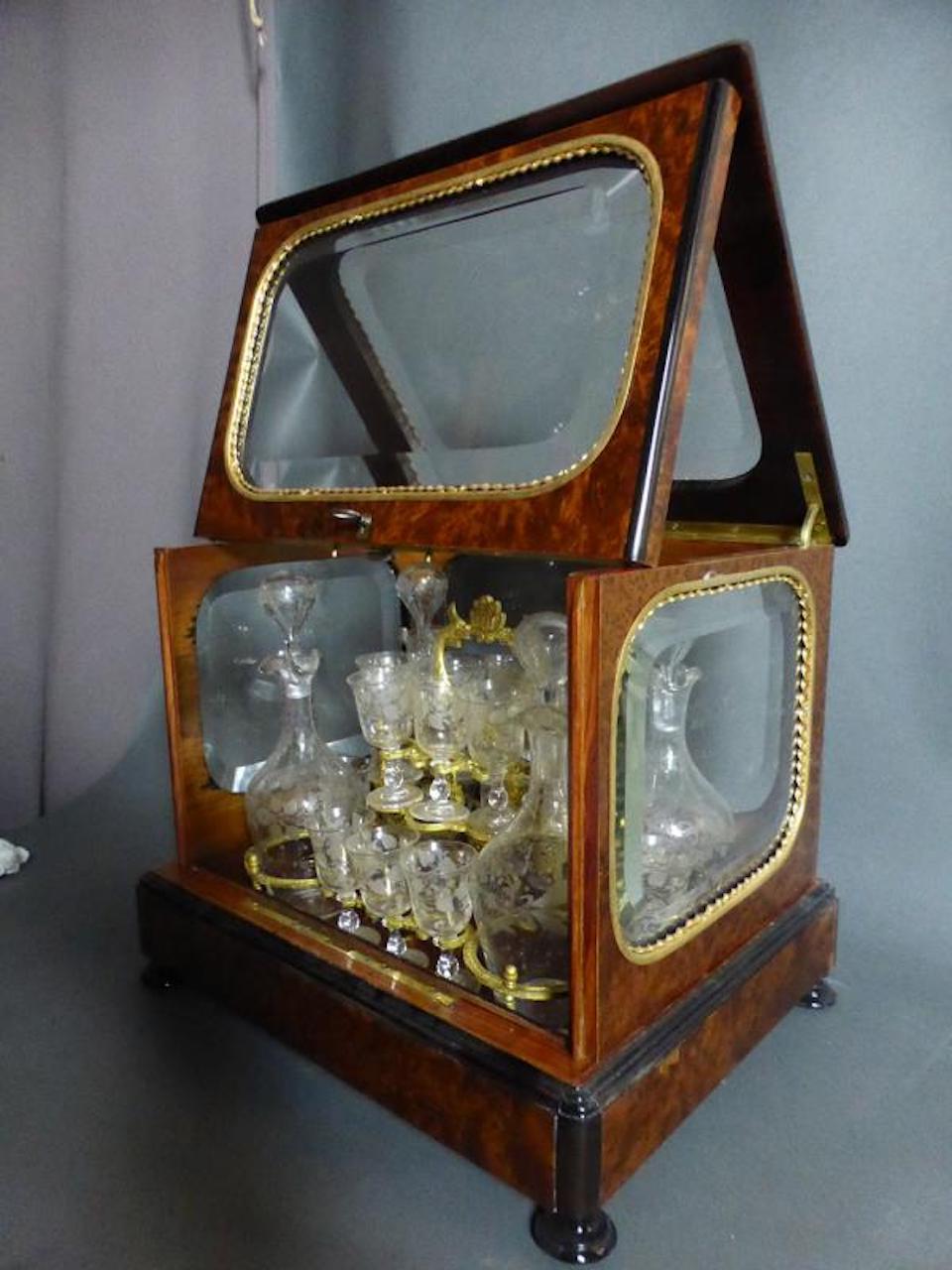 Beautiful 19th century French liquor cellar in native wood marquetry and beveled glasses.
This one is complete with its glassware 4 decanters and 16 glasses.
Very good condition and quality.