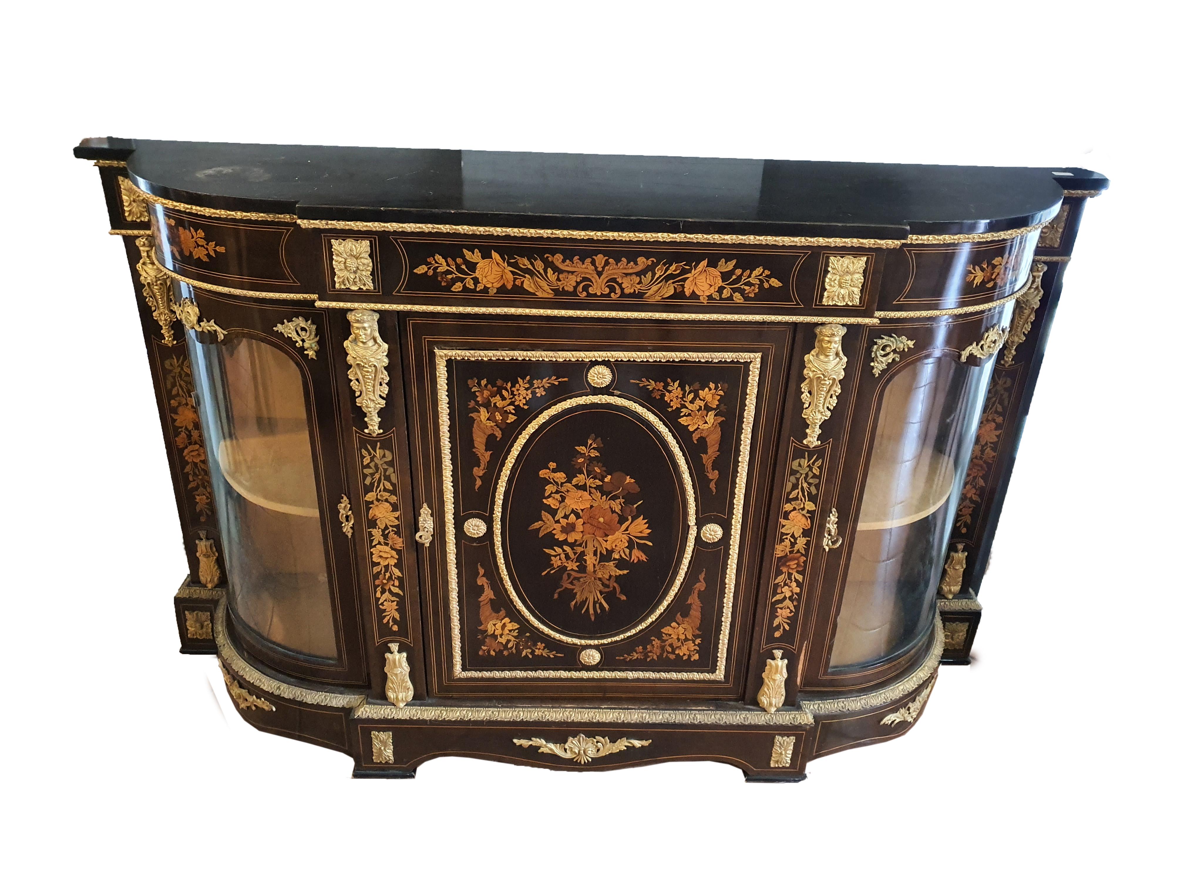 Elegant and important sideboard with three doors, entirely inlaid with floral motifs with applications in finely chiseled and gilded bronze, contemporary with the piece of furniture.