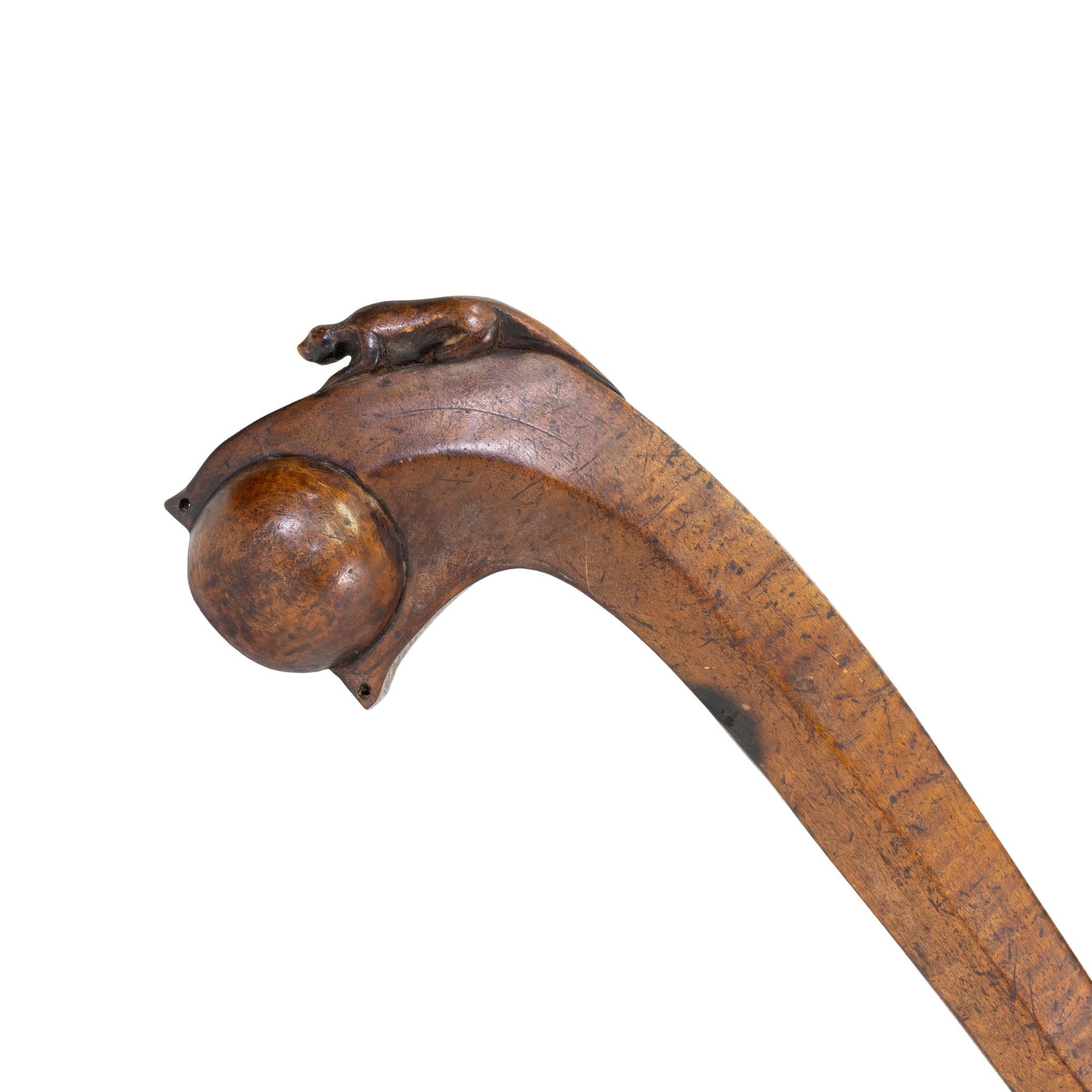 Ball headed war club of walnut with carved panther effigy. The panther is rare and a powerful warrior symbol that has different interpretations 