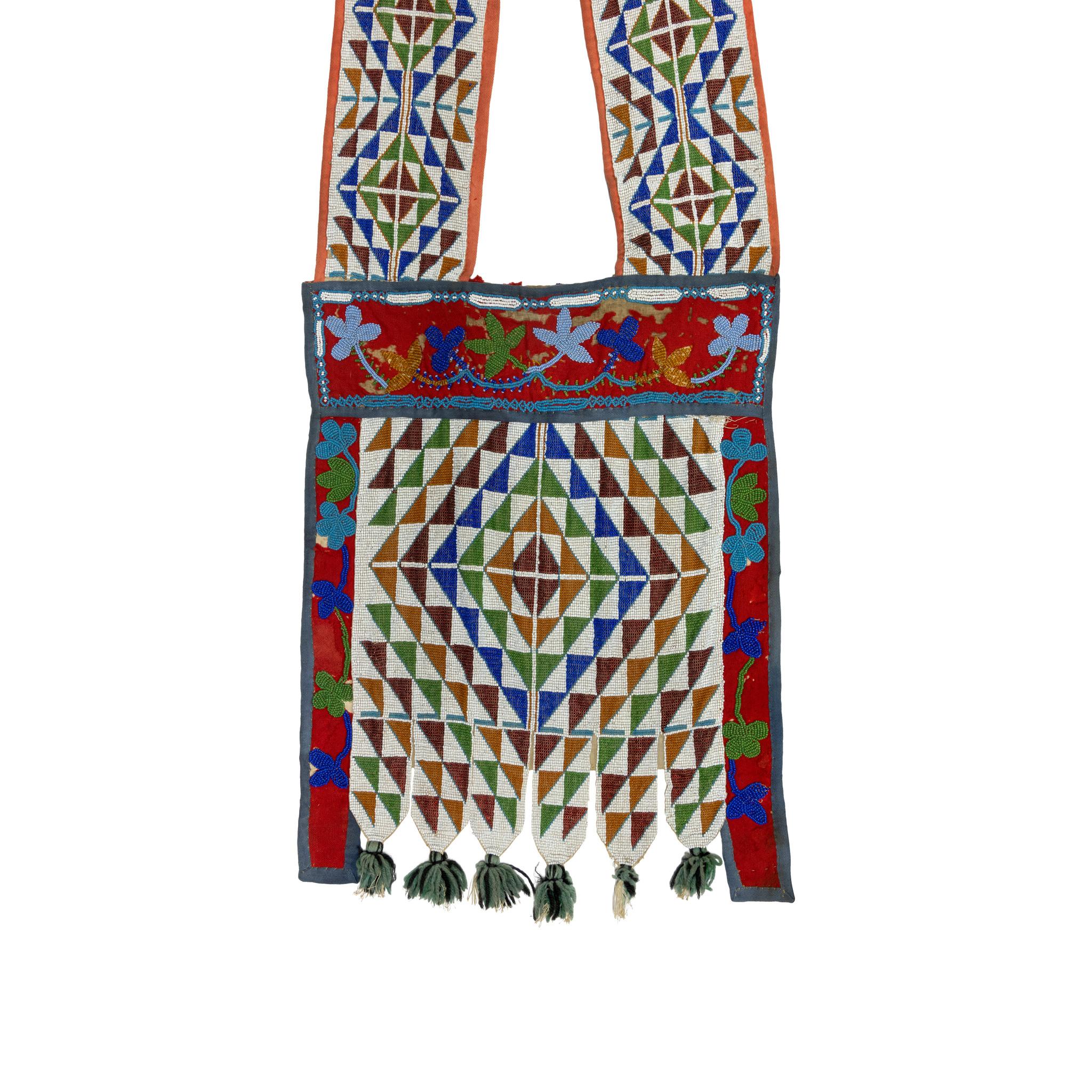 Genuine geometric Native American Sauk people bandolier bag with loom beaded geometric panels. Blue and black yarn tuffs. Minor deterioration on red salvage, not distracting. Great visual and colorful piece. The Sac or Sauk are a group of Native