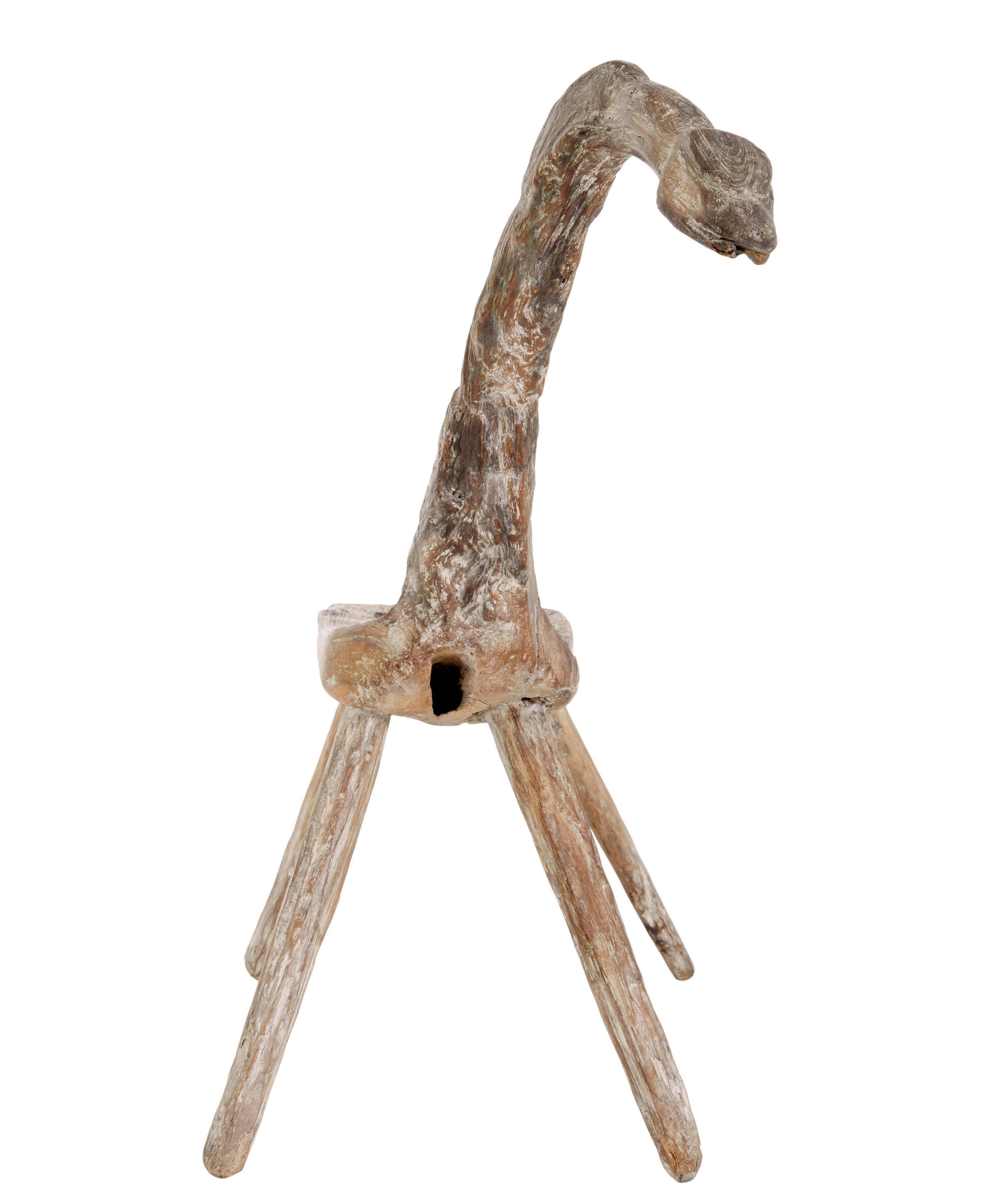 
Unique 19th century natural form oak childs stool circa 1880.

Rare children's stool in the form of a long necked bird, horse or dinosaur, made from oak in its natural shape, with doweled in legs.

More of a decorative piece than for everyday