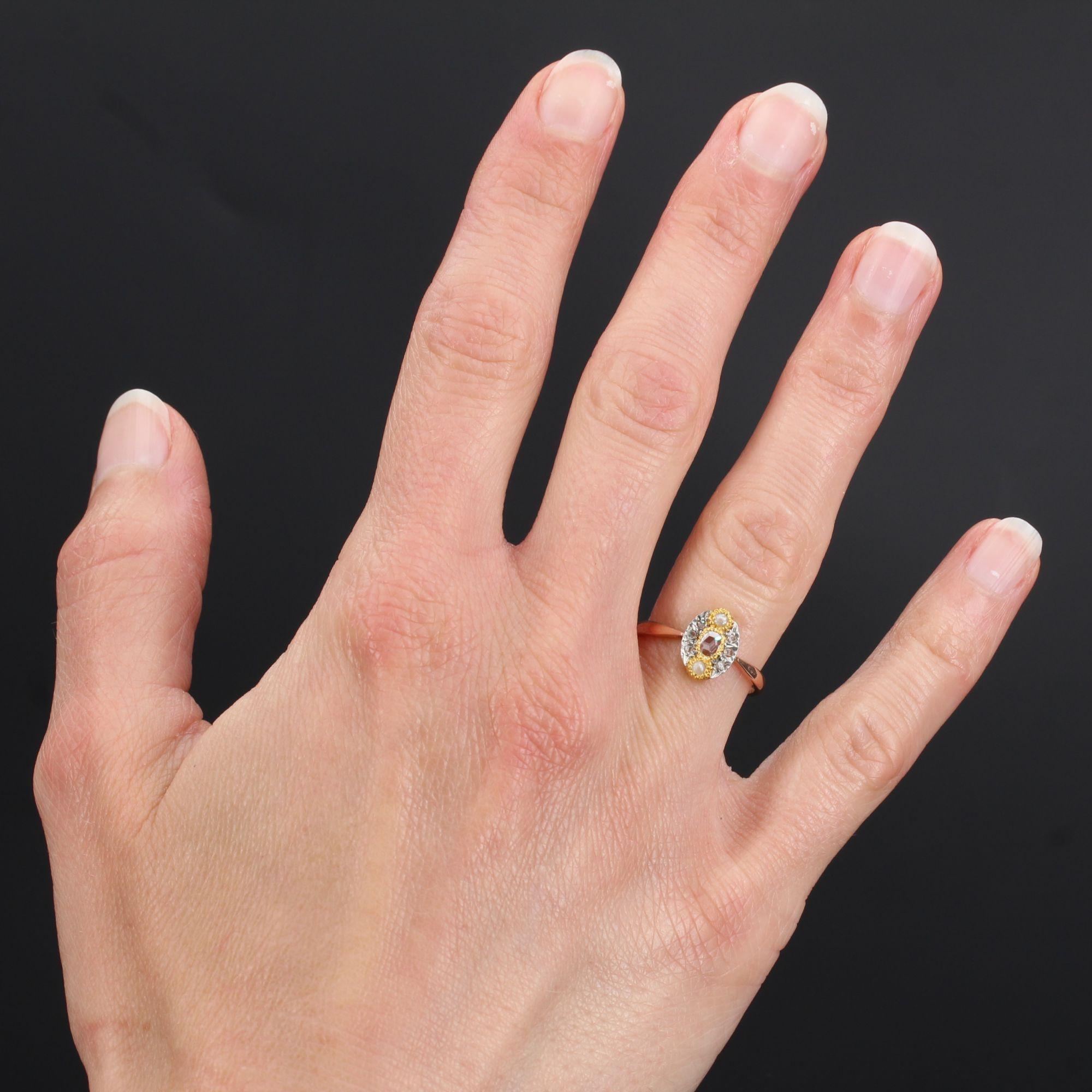 Ring in 18 karat rose gold, owl hallmark and silver.
Of marquise form, this charming antique ring is decorated with a rose-cut diamond of champagne tint, surmounted and at the base of a half natural pearl, the whole on yellow gold millegrain