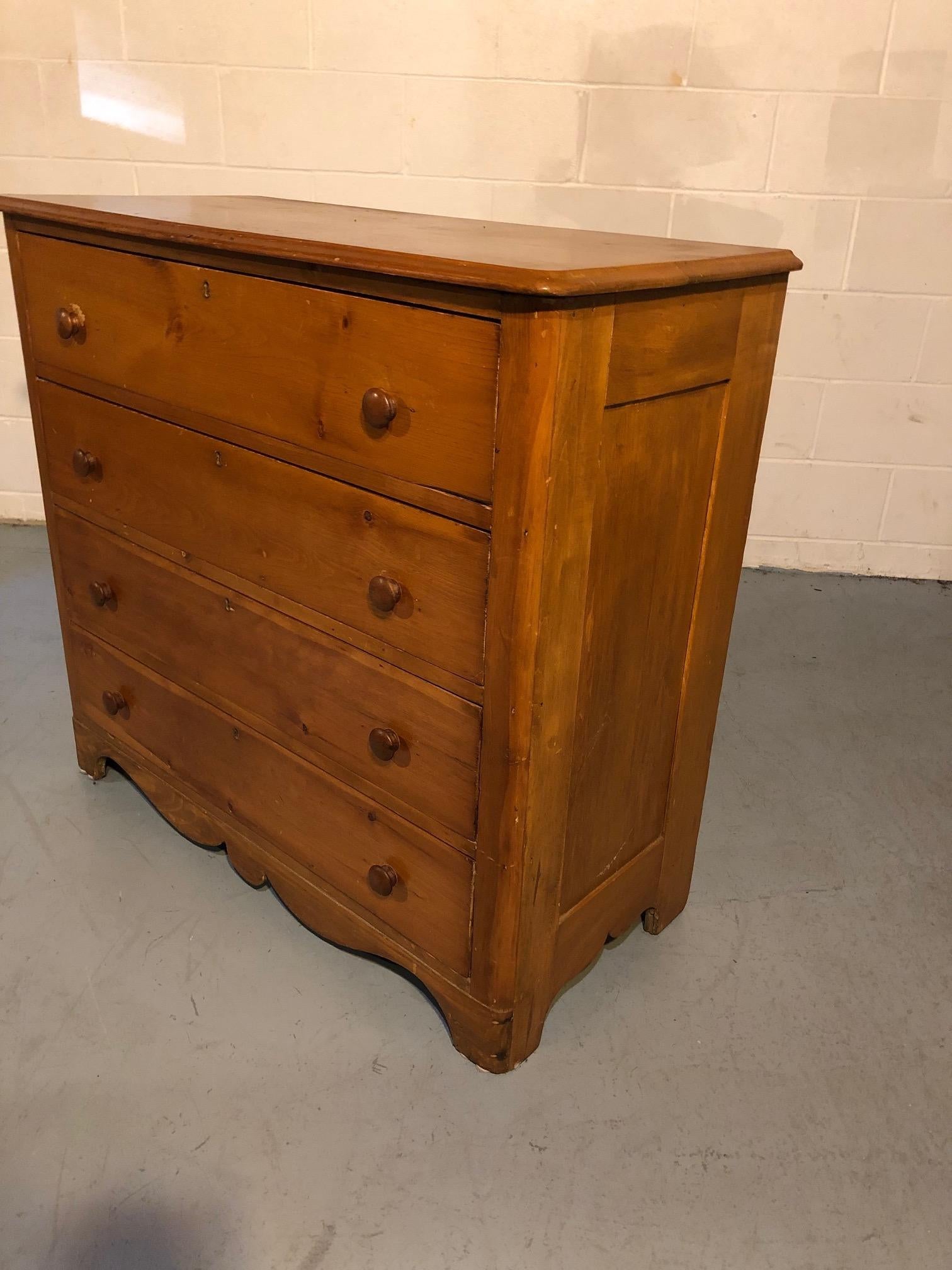 Pre-Civil War natural pine dresser having a classic simple design including 4 drawers with round wooden pulls. Each drawer measures 32 long x 13 deep x 6.5 in height