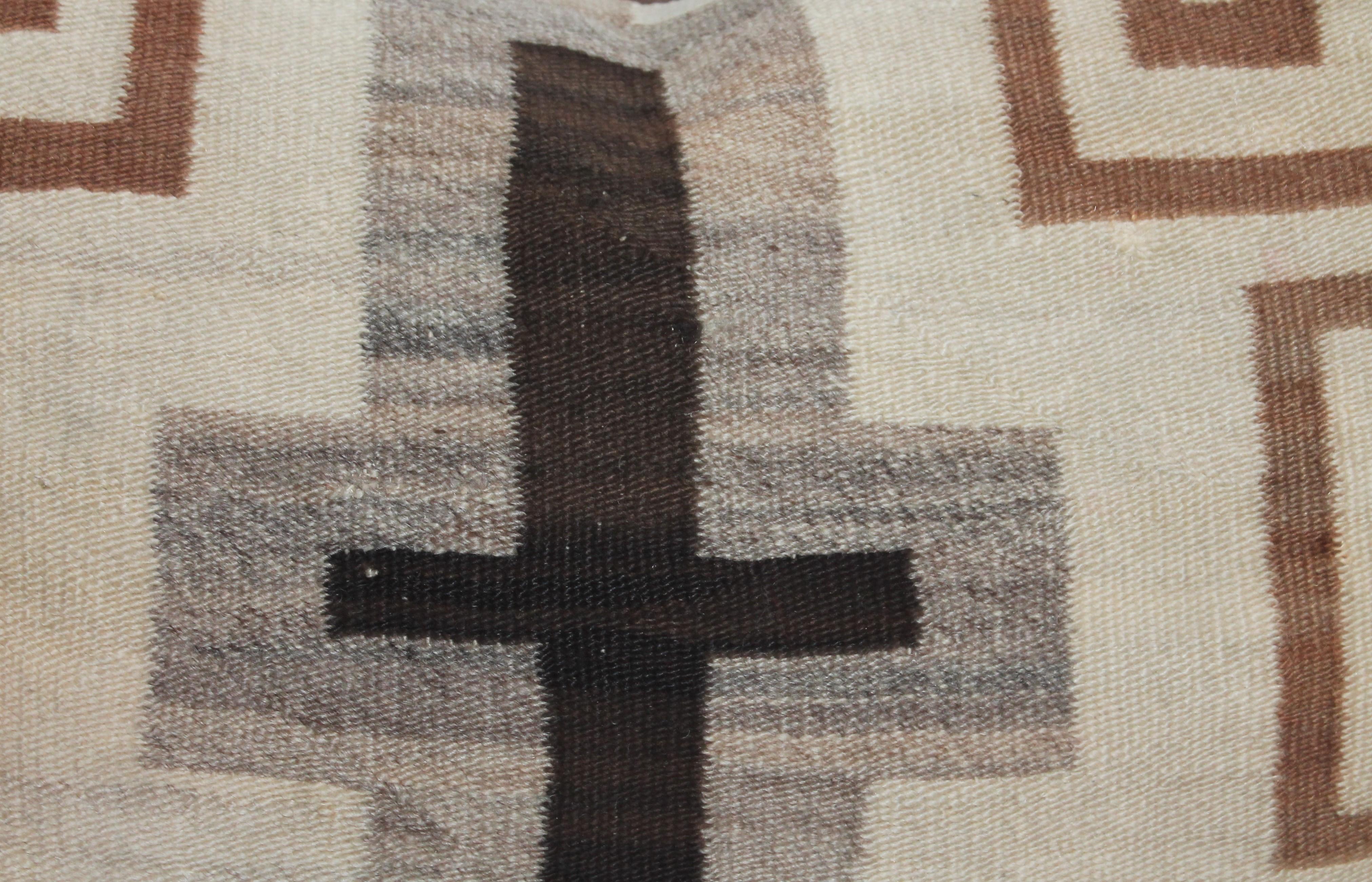This fine early Navajo Indian weaving with a cross in the centre. The backing is in dark brown cotton linen. This is a transitional weaving.
