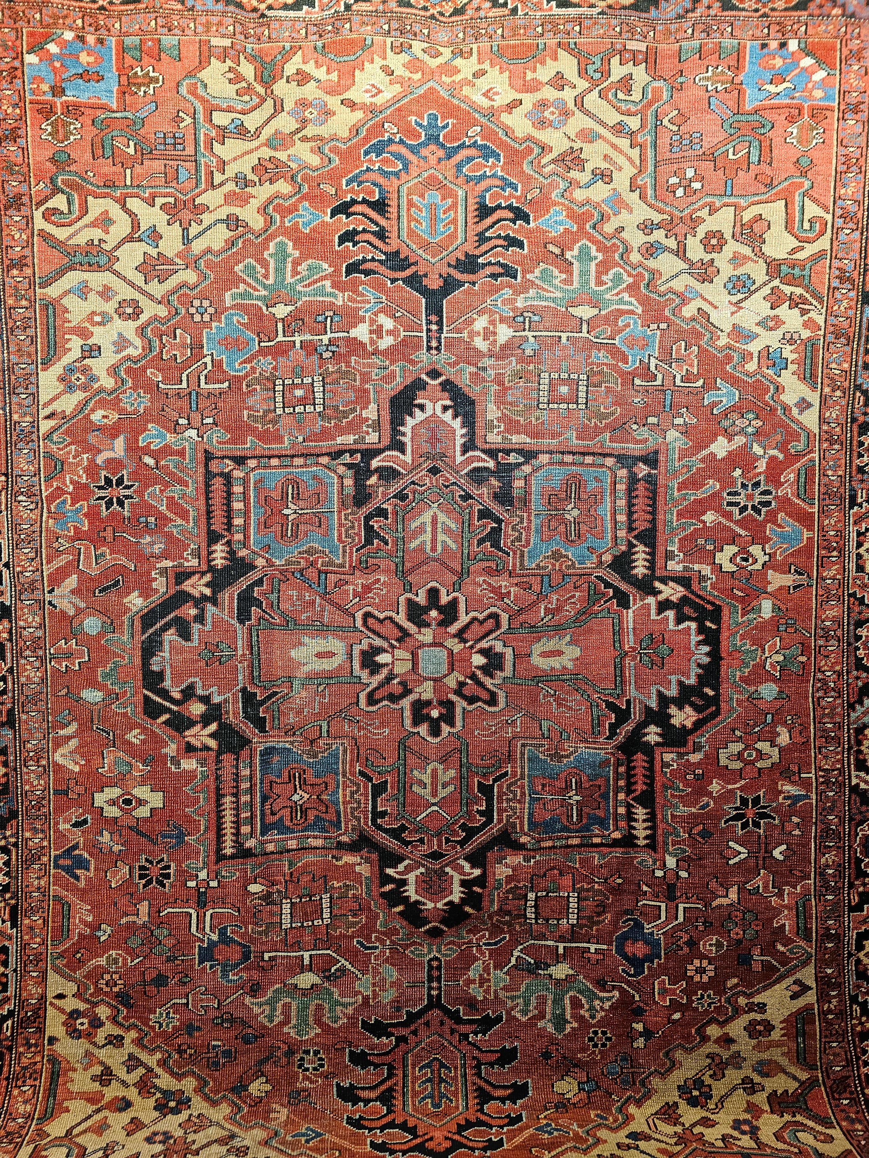 A near square size Persian Serapi from the late 1800s.  The rug has a beautiful Serapi open and uncluttered design in a wonderful color combination.  The background color is terracotta with large format geometric forms.  The design accent colors