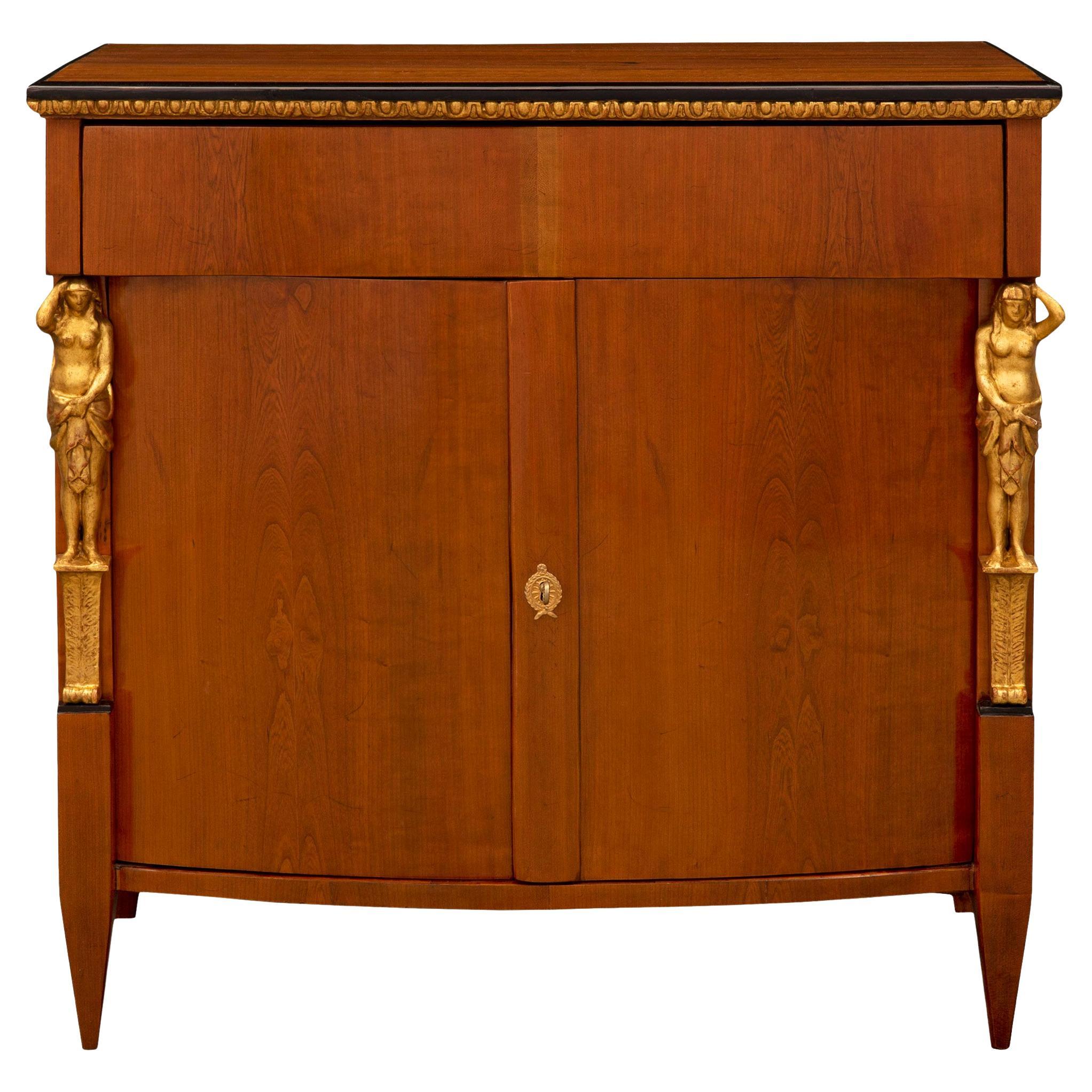 Armoire néoclassique du 19ème siècle en merisier, bois fruitier et bois doré