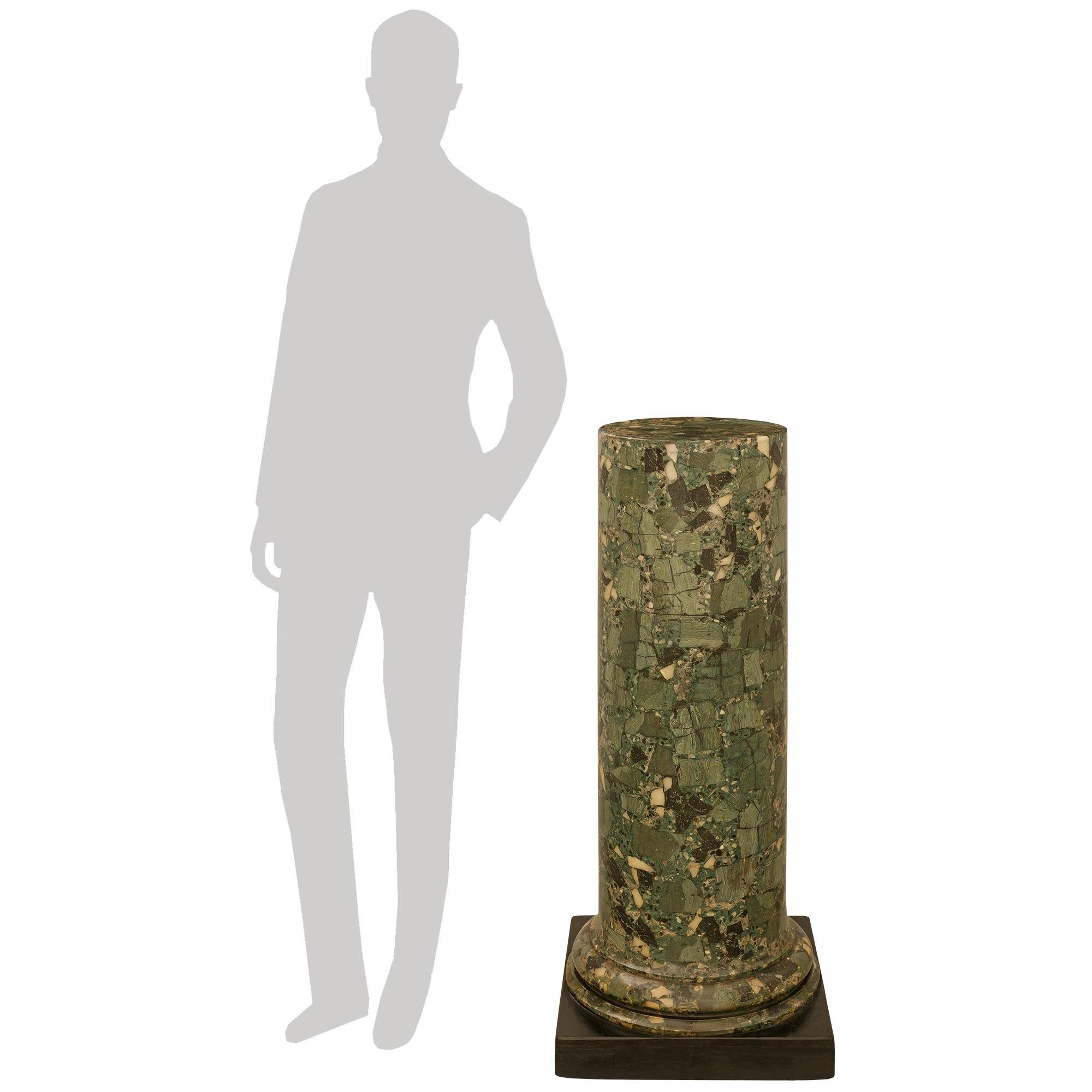 A handsome and most impressive Italian 19th century Neo-Classical st. Scagliola and patinated Wood pedestal/column. This wonderful column is raised by a patinated black square plinth below the faux painted Verde Antico Scagliola column with a