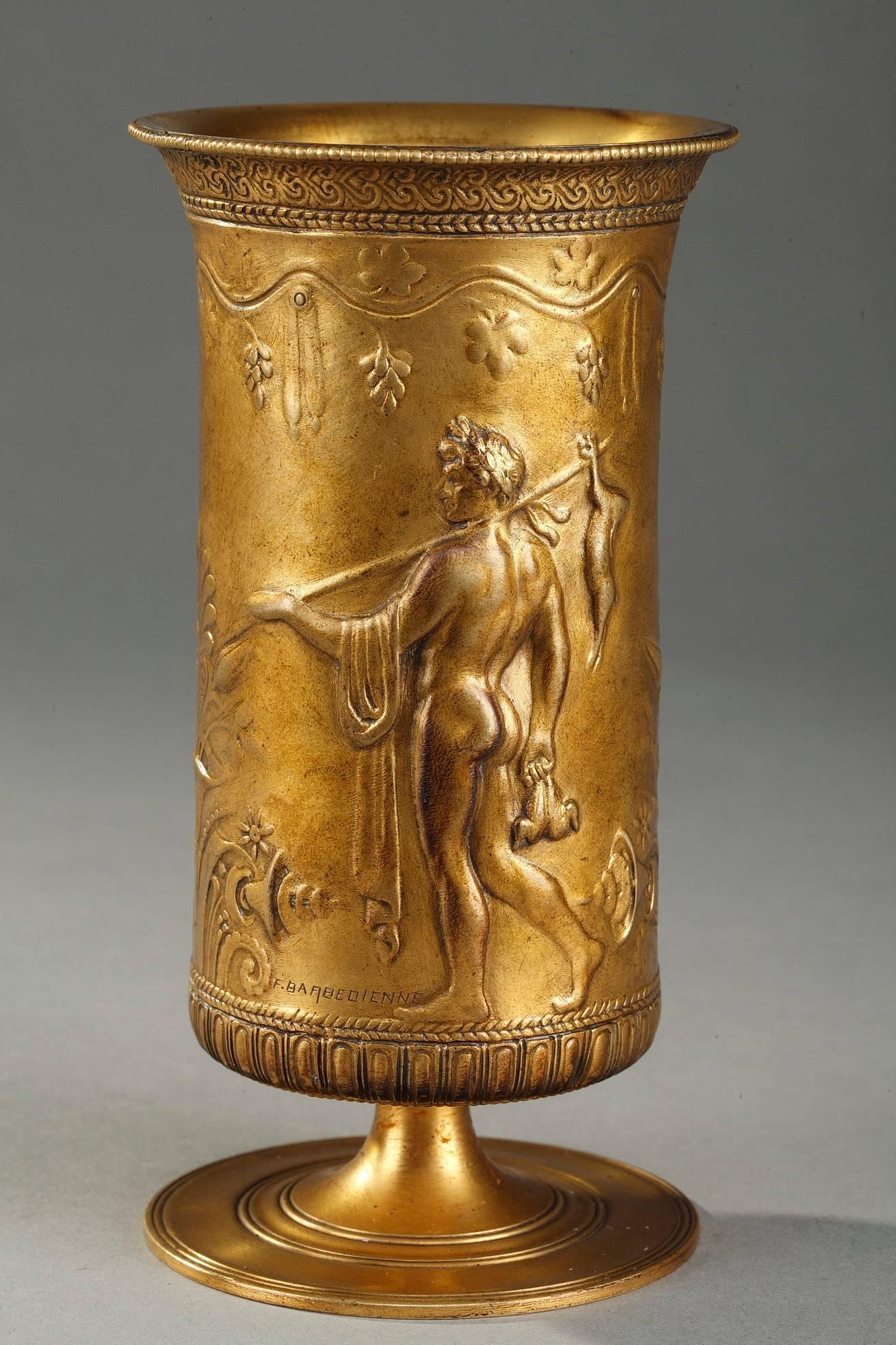Pair of cylindrical ormolu, or gilt bronze, cups depicting hunting and picking fruits scenes in Classical style. Each neo-Greek cup is decorated with vine leaves, Greek waves, small pearls and ova. Signed F. LEVILLAIN for Ferdinand Levillain