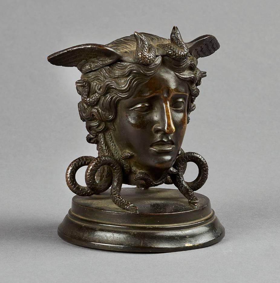 Very attractive bronze inkwell from the second half of the 19th century in the form of the head of Medusa, with a hinged lid revealing a brass liner.