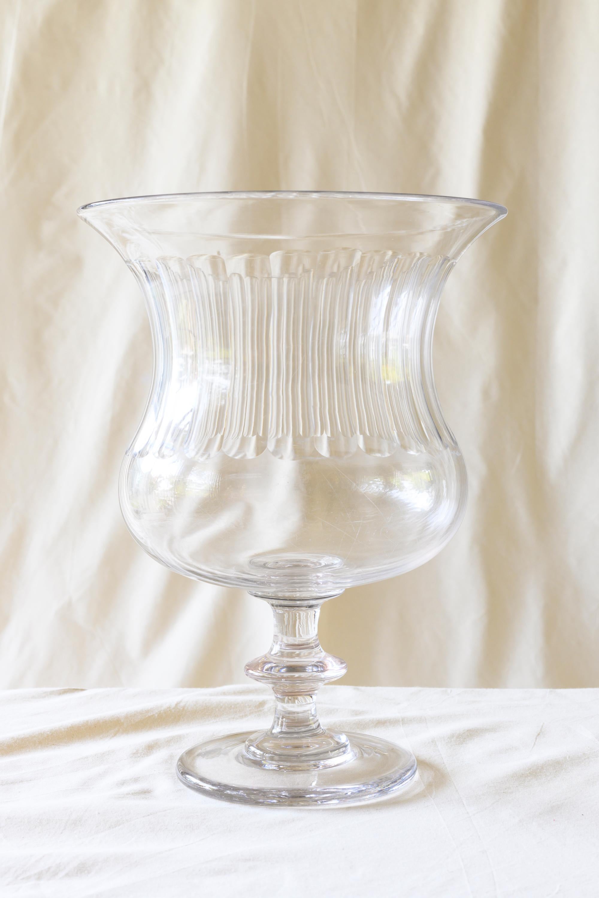 This crystal urn, with its exquisitely ribbed bowl and baluster shaft, was likely one in a pair and would be perfect for a floral centerpiece. 

Provenance: a chateau near Vienne, France.