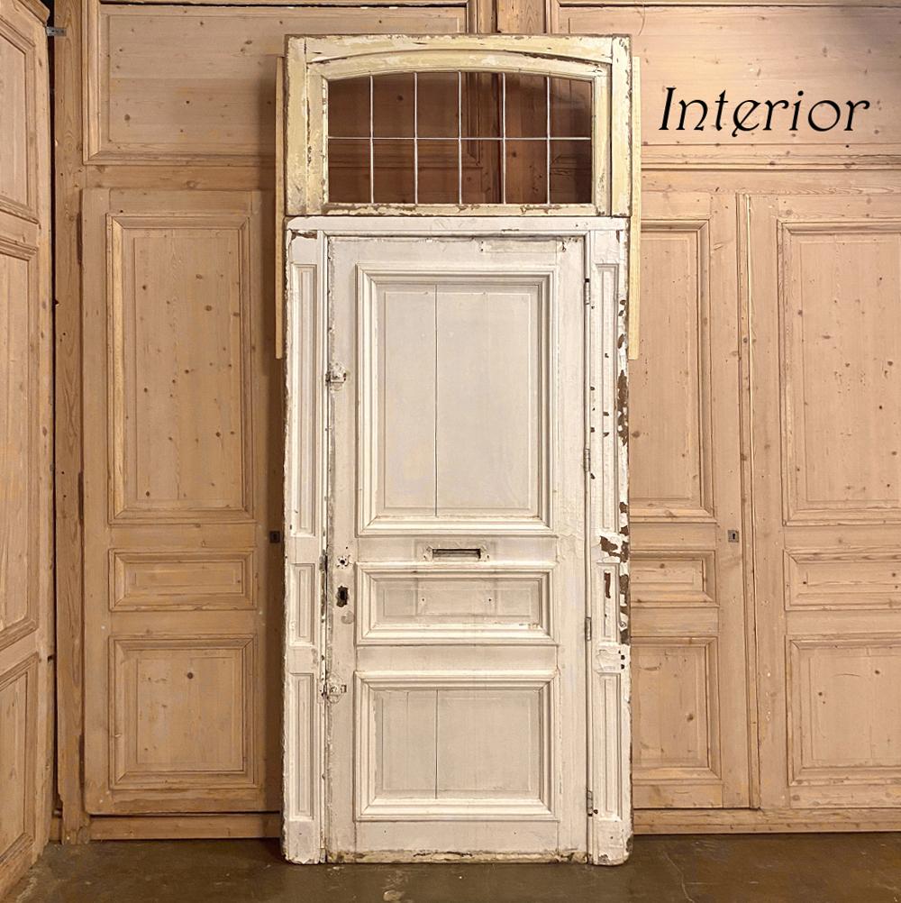 19th century neoclassical exterior door with transom and jamb is a masterpiece of timeless architecture, poised to make your entryway unique and truly special! Amazing detail can be seen in the carved embellishments and fine molding detail, with