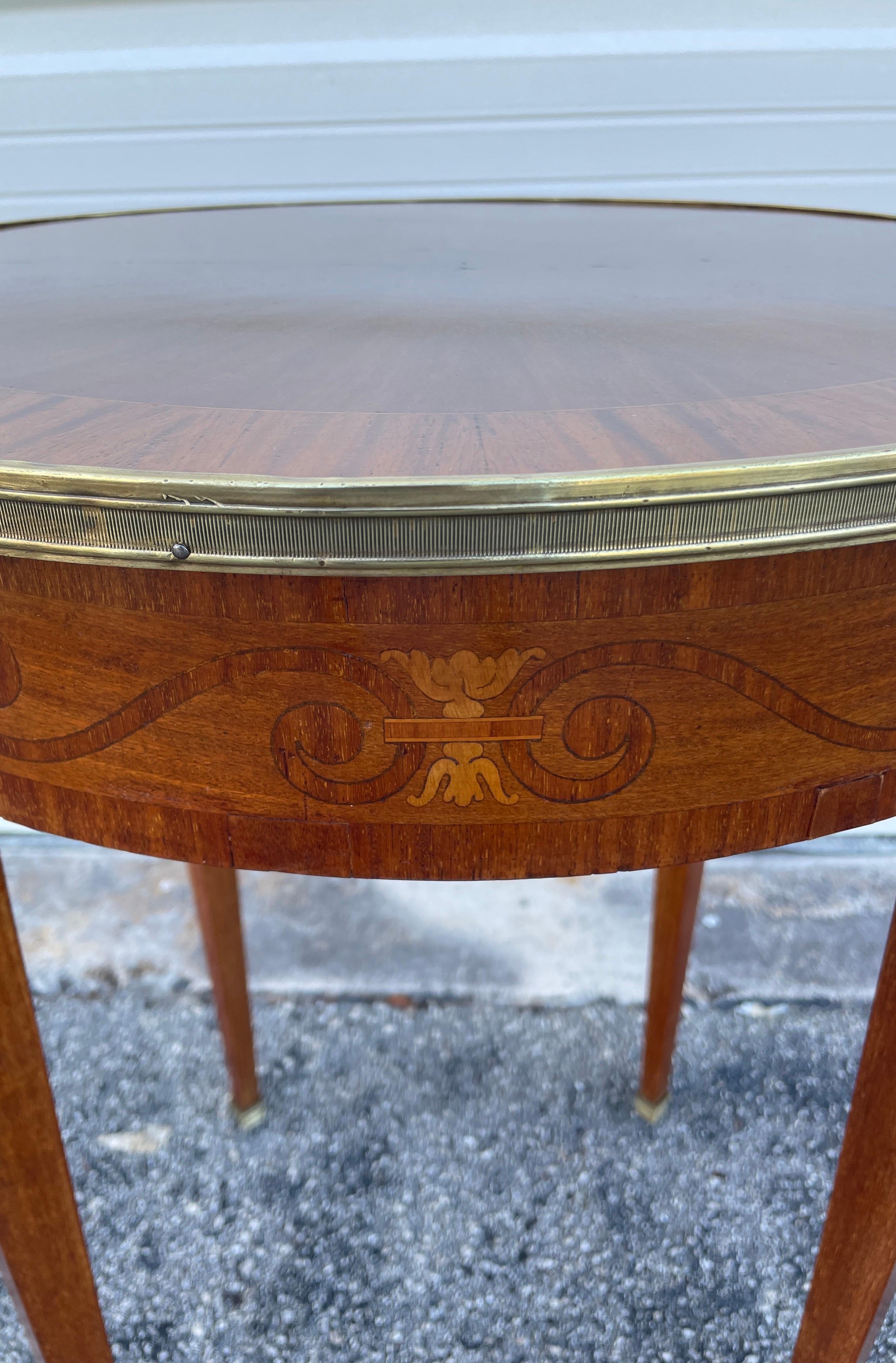 19th Century Neoclassical style side table with brass banding around top and at feet. Beautifully detailed top and marquetry inlaid surrounds.