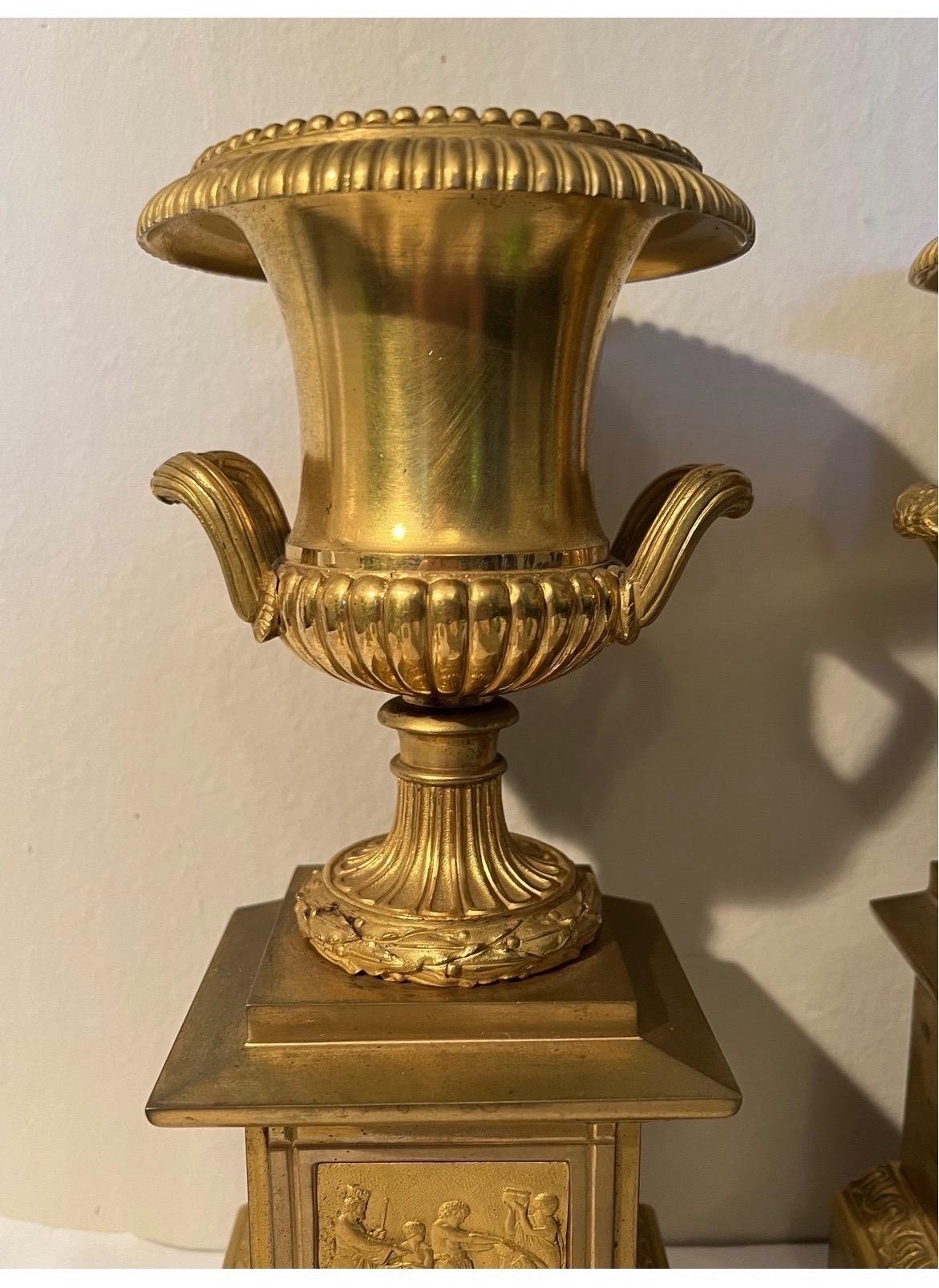 These urns are extremely high quality in decoration and casting. True Neoclassical gilt bronze grand tour objects and what makes it better? A PAIR!.
