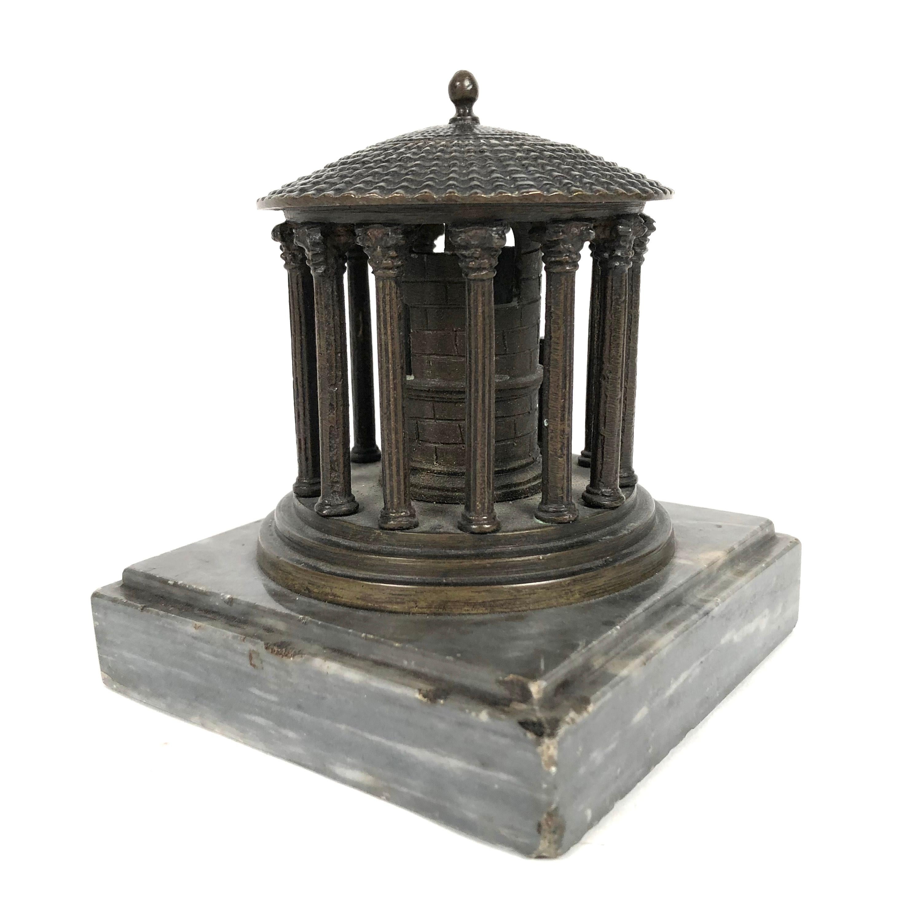 A 19th century Grand Tour neoclassical  bronze architectural model of the Temple of Vesta, Rome, circa 1875, on a square grey marble base. The primary value in going on the Grand Tour was the exposure it provided to the cultural legacy of classical