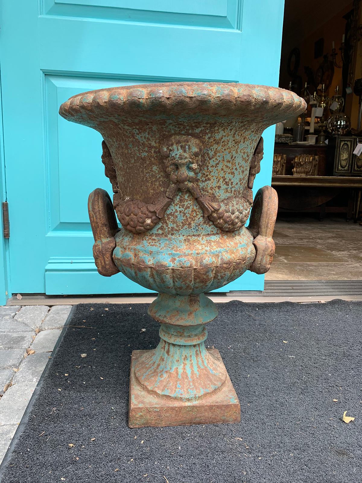 19th century neoclassical iron urn with beautiful old blue paint.