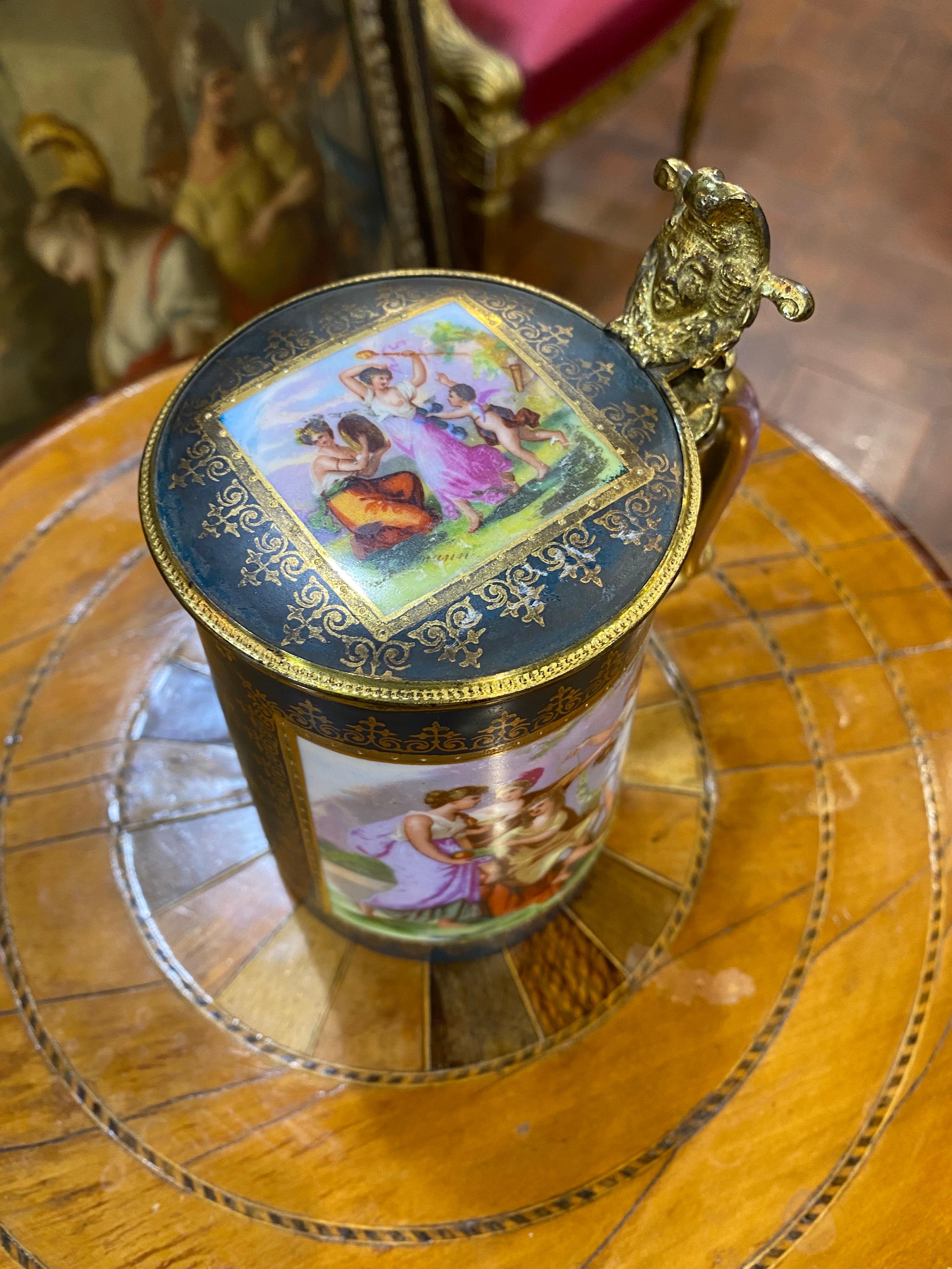 A Vienna style lidded tankard, the central image with four characters, after Kaufmann, within a raised gilt wreath and green ground.
In excellent state of preservation.