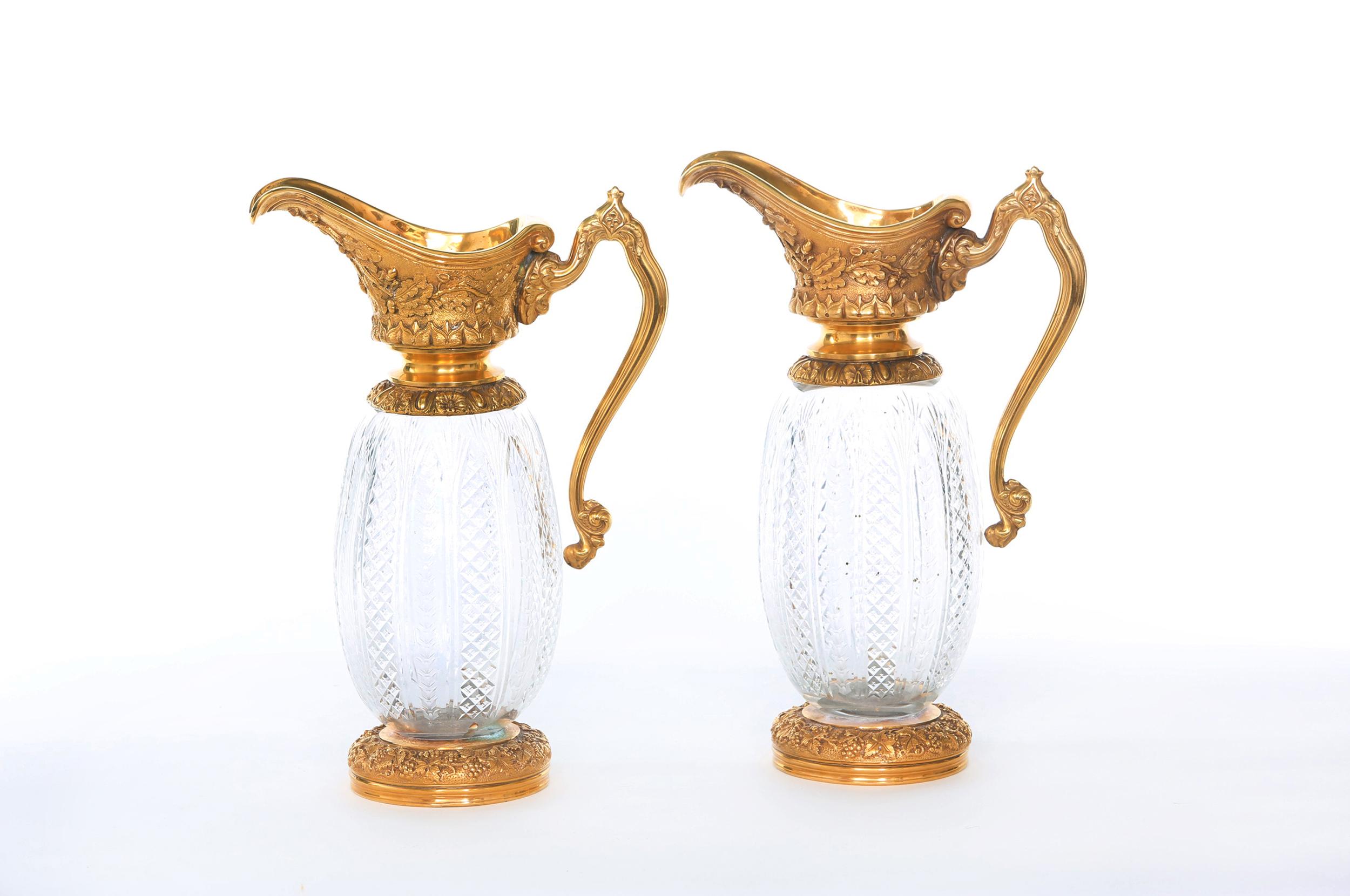 Impressive pair of French 19th century neoclassical style bronze and ormolu decorative design details ewers. Each one is in great condition. Minor wear consistent with age or use. Each ewer stands about 16.5 inches x 11 inches x 6.5 inches.
   