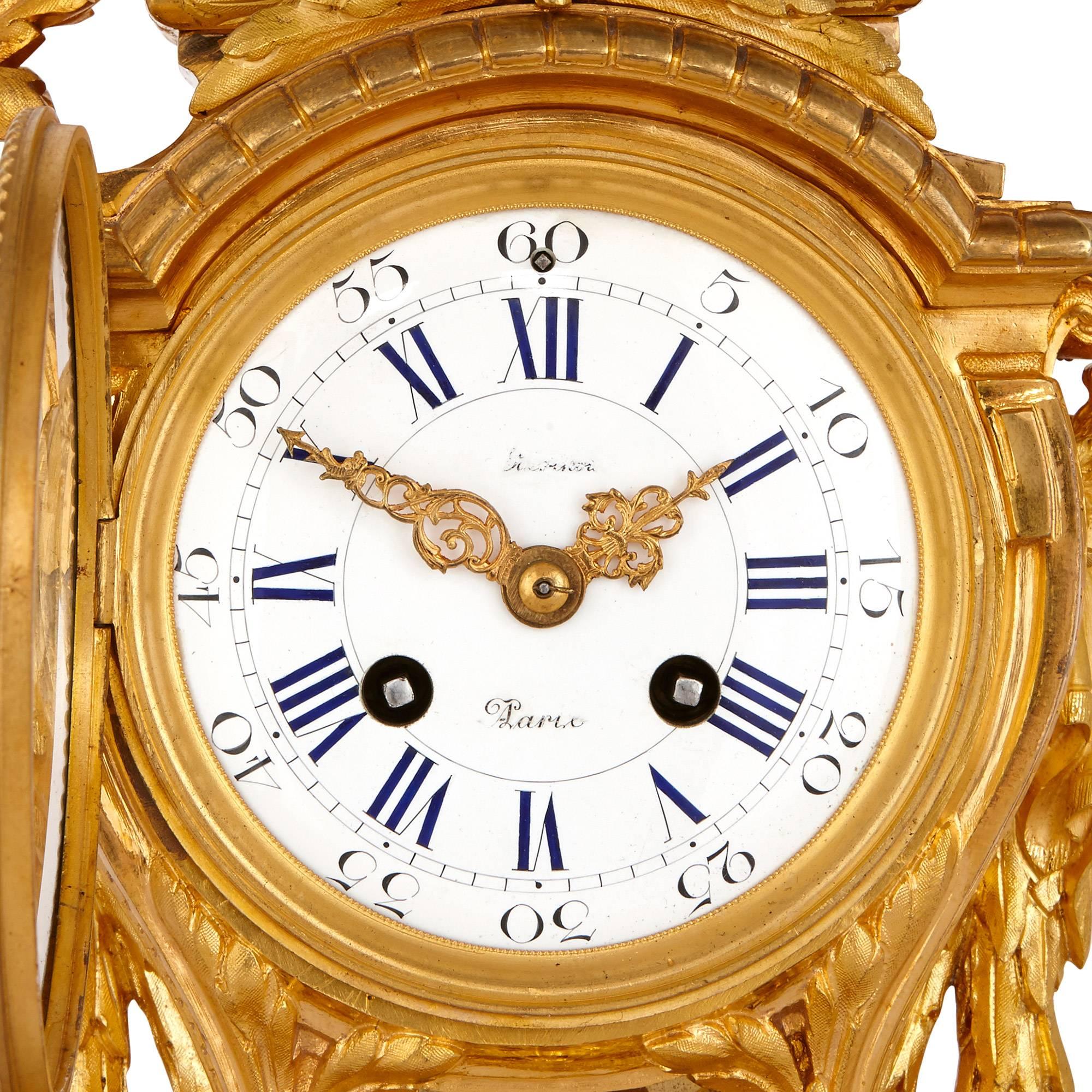 This grand and impressive clock set is the work of the famed French maker Henri Picard, who was celebrated for the regal charm and ceremonial splendour of his creations, of which this piece is no exception. 

The set comprises a central clock and