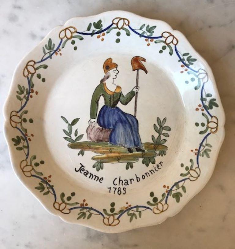 A late 19th century Nevers French faience pate, hand painted with the image of French patriot Jeanne Charbonnier surrounded by leaves and berries. The images with the date 1789 signifies the beginning of the French Revolution, she represents