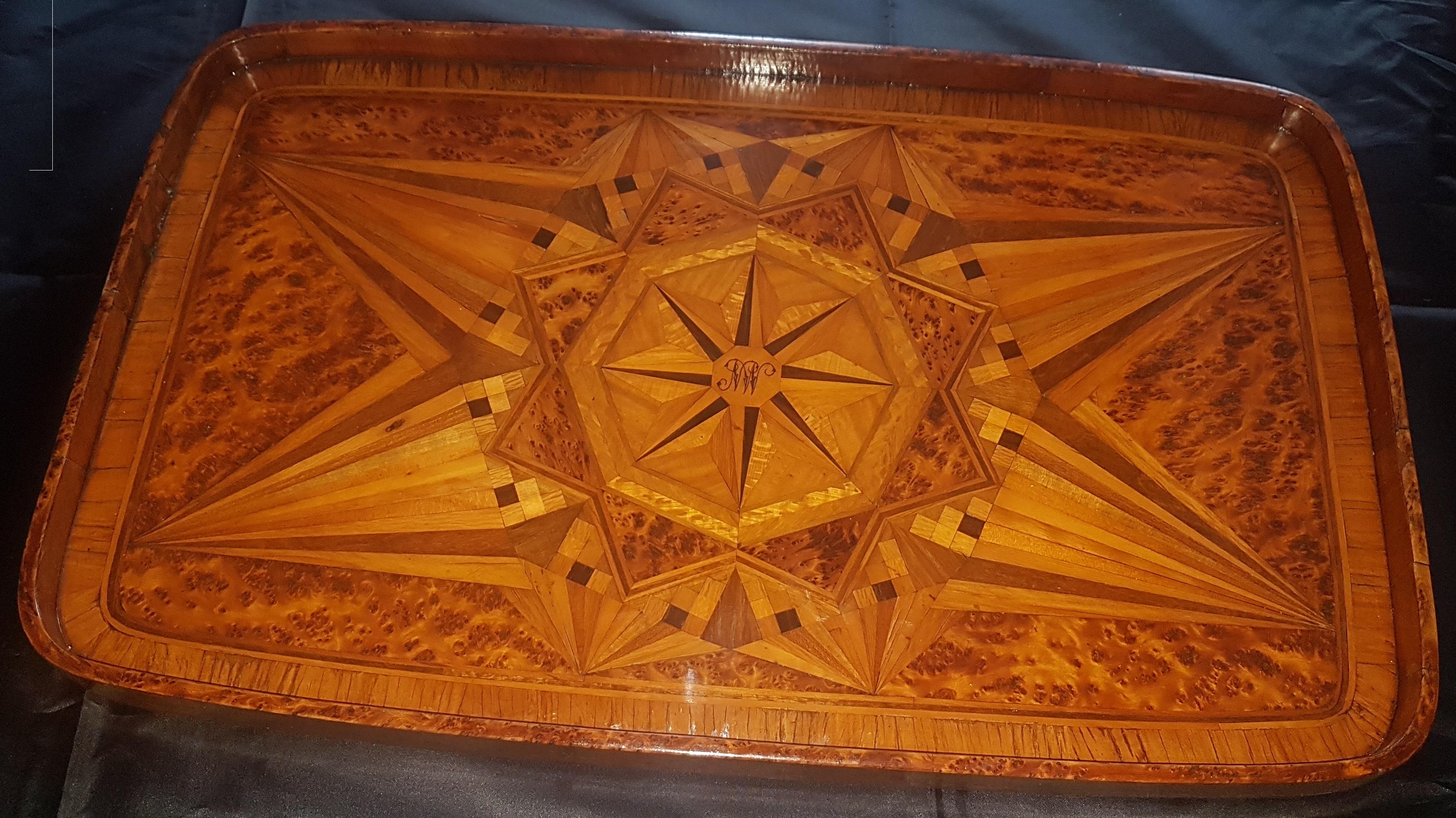 A very nice large late 19th century New Zealand specimen timber serving tray that is most likely by Anton Seuffort. The design and style of marquetry is very much like other examples of his work. The centre of the tray has an octagonal disc of Kauri