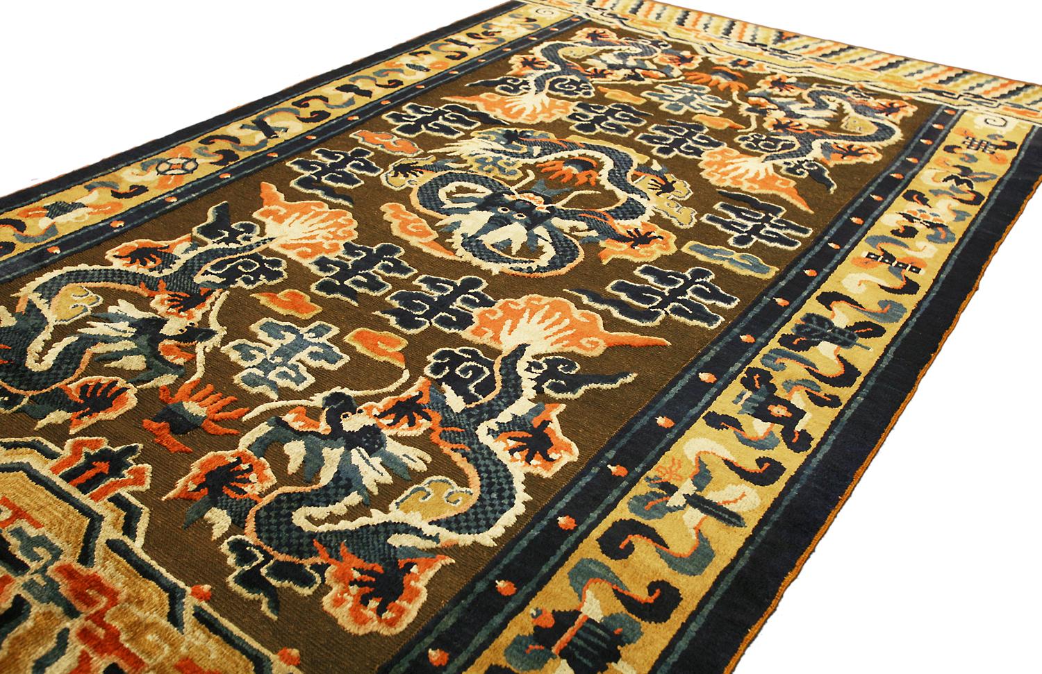 This is a silk souf Ningxia rug woven during the end of the 19th century. It is made of 100% silk pile and the background of the carpet is made using a flat weave technique with metal threads. The design of the rug is a central dragon with five
