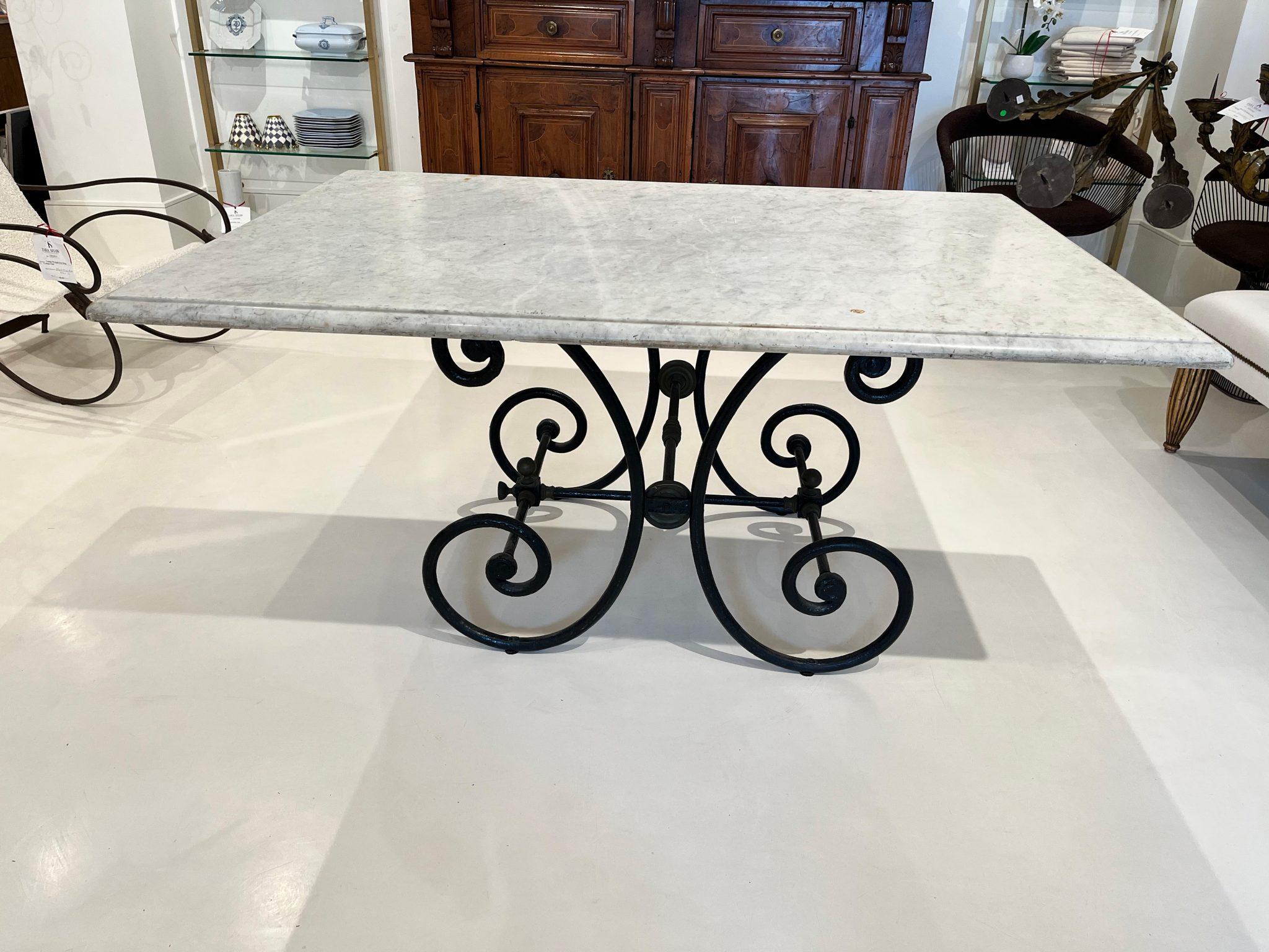 This beautiful large scale marble topped table doesn't scream for attention but gets it anyway.  The sheer size and quality of the marble is extraordinary.  Beautifully veined with some minor loses at the ogee edge and one small curious repair on