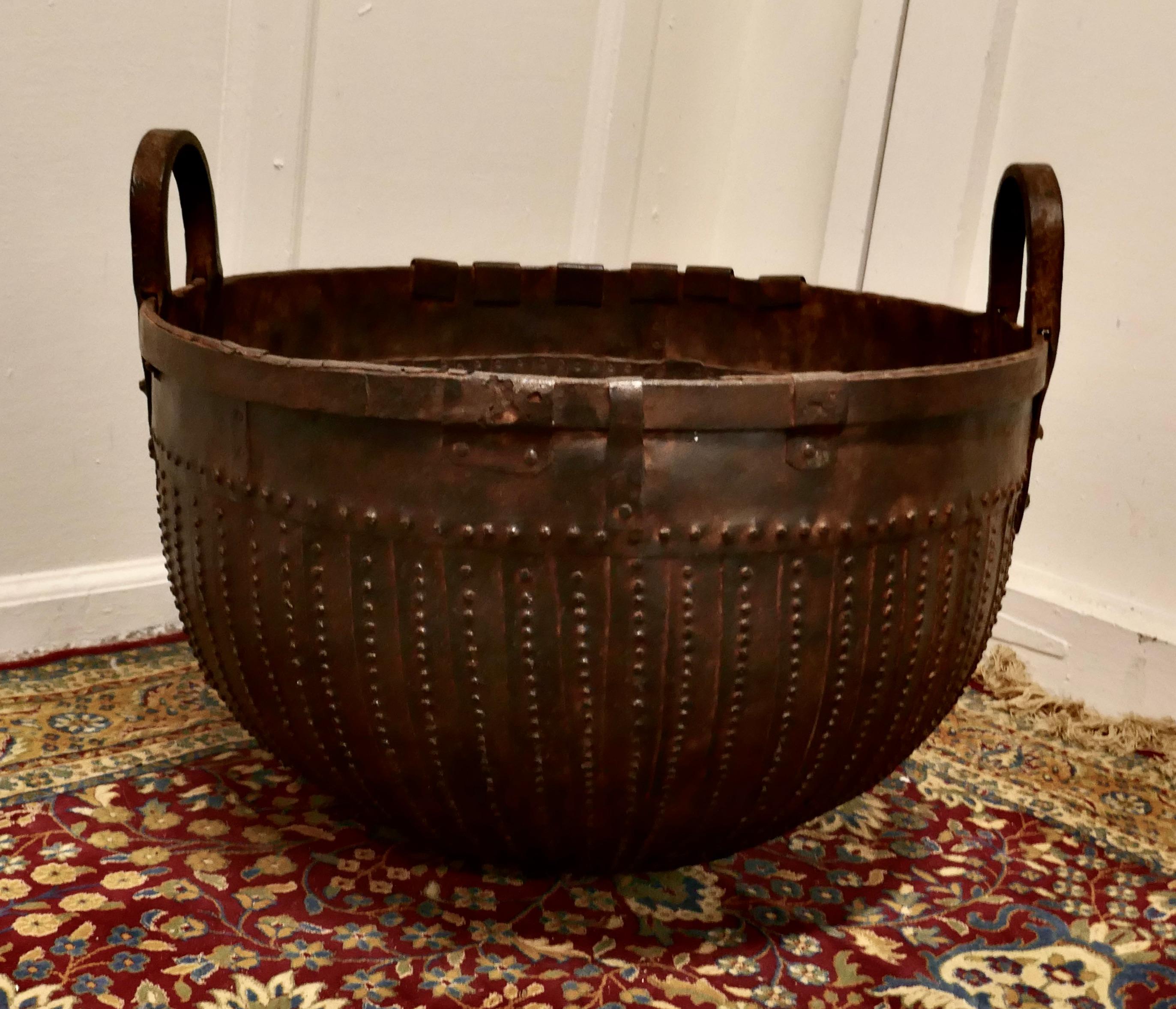 19th Century North African Cooking Pot, Brutalist Log Basket

Stud and Riveted Cooking Pot from North Africa, the vessel is made in hand forged Iron, it has 2 strong carrying handles

An amazing piece, the main body is made up with layered