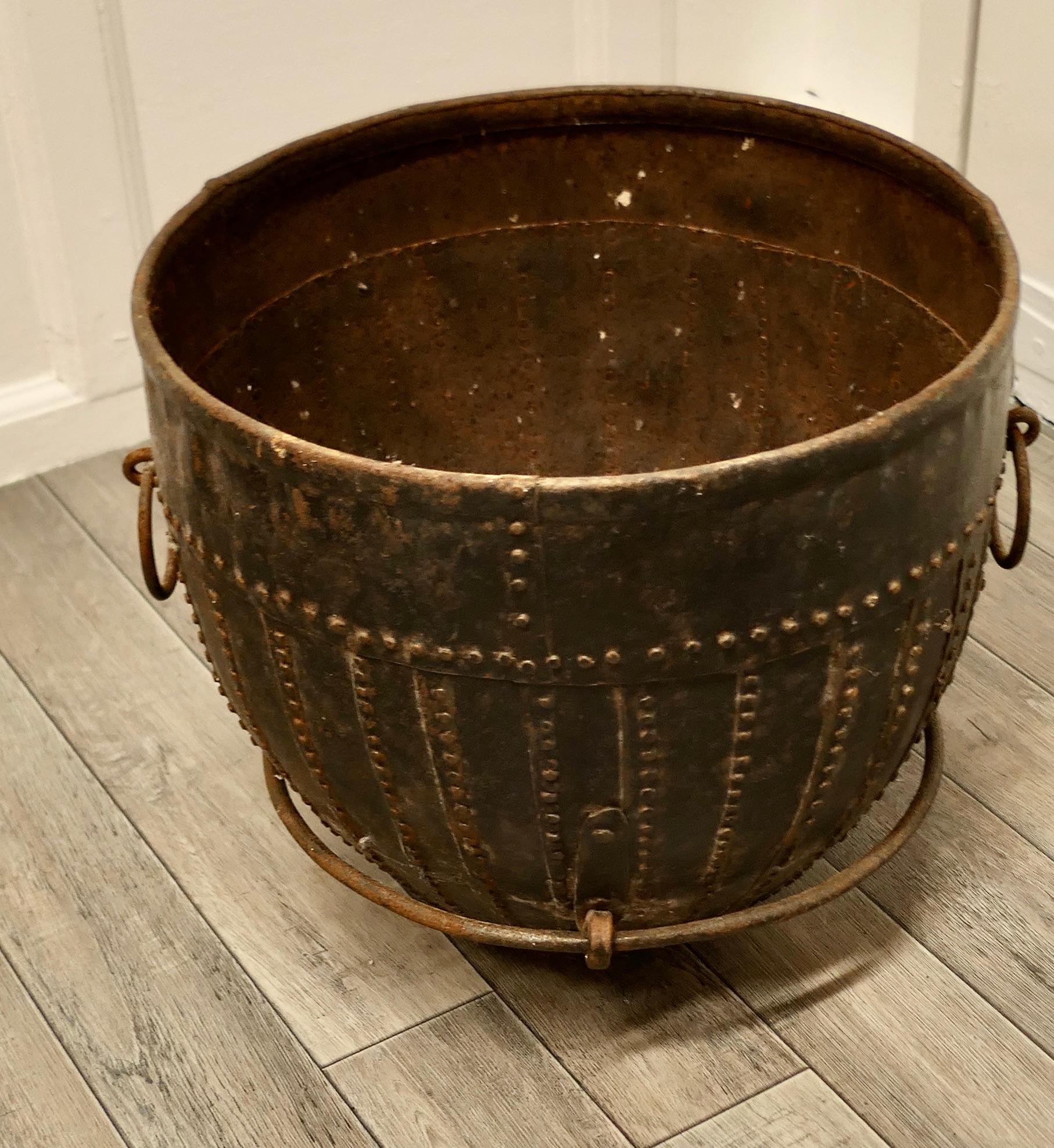 19th Century North African cooking pot, Brutalist log basket.

Stud and Riveted Cooking Pot from North Africa, the vessel is made in hand forged Iron, it has 2 ring carrying handles

An amazing piece, the main body is made up with layered