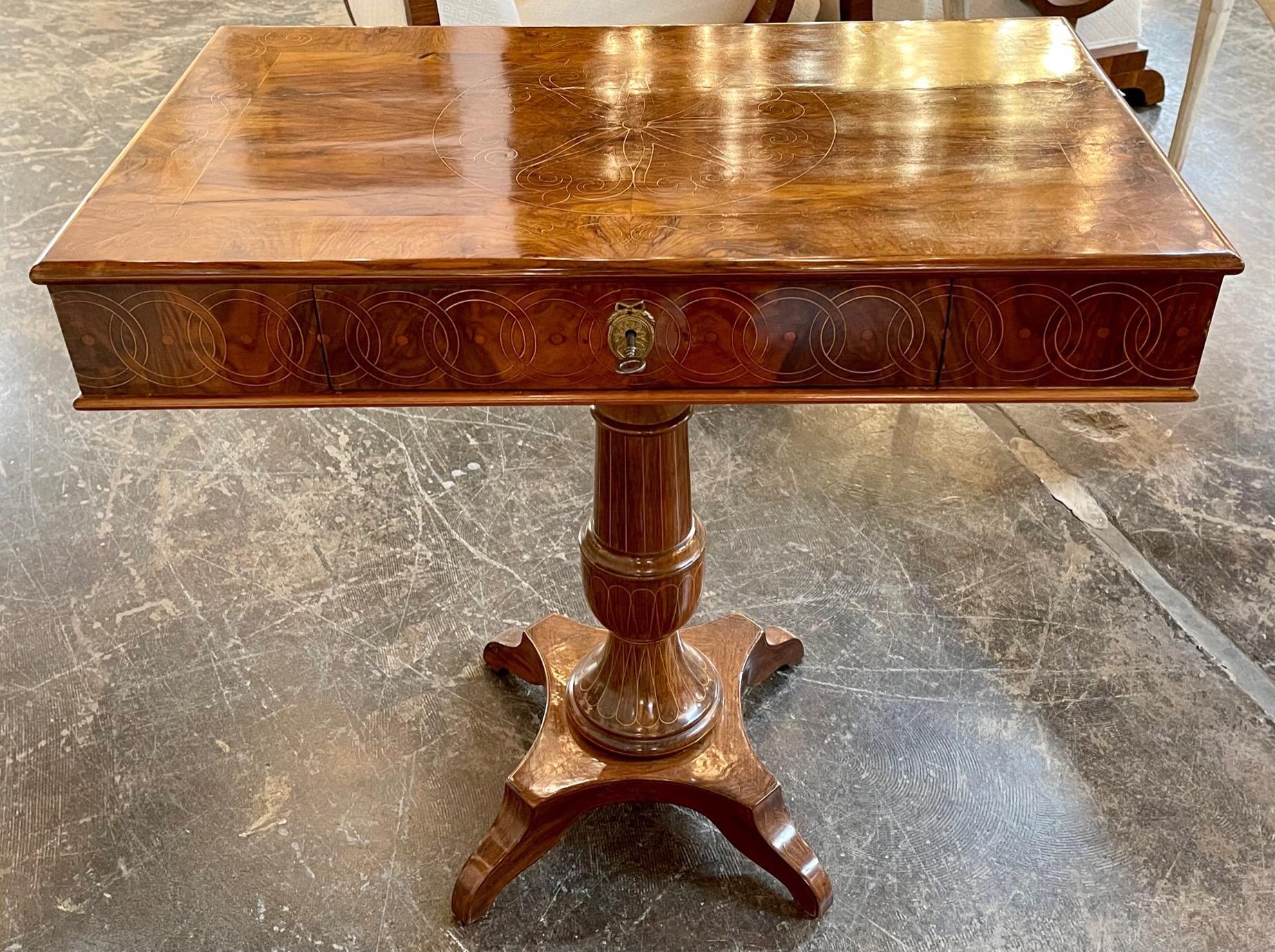 Handsome 19th century Northern Italian crotch mahogany side table. Beautiful flower pattern on the top of the table along with circular patterns along the edge of the table. Very special!
