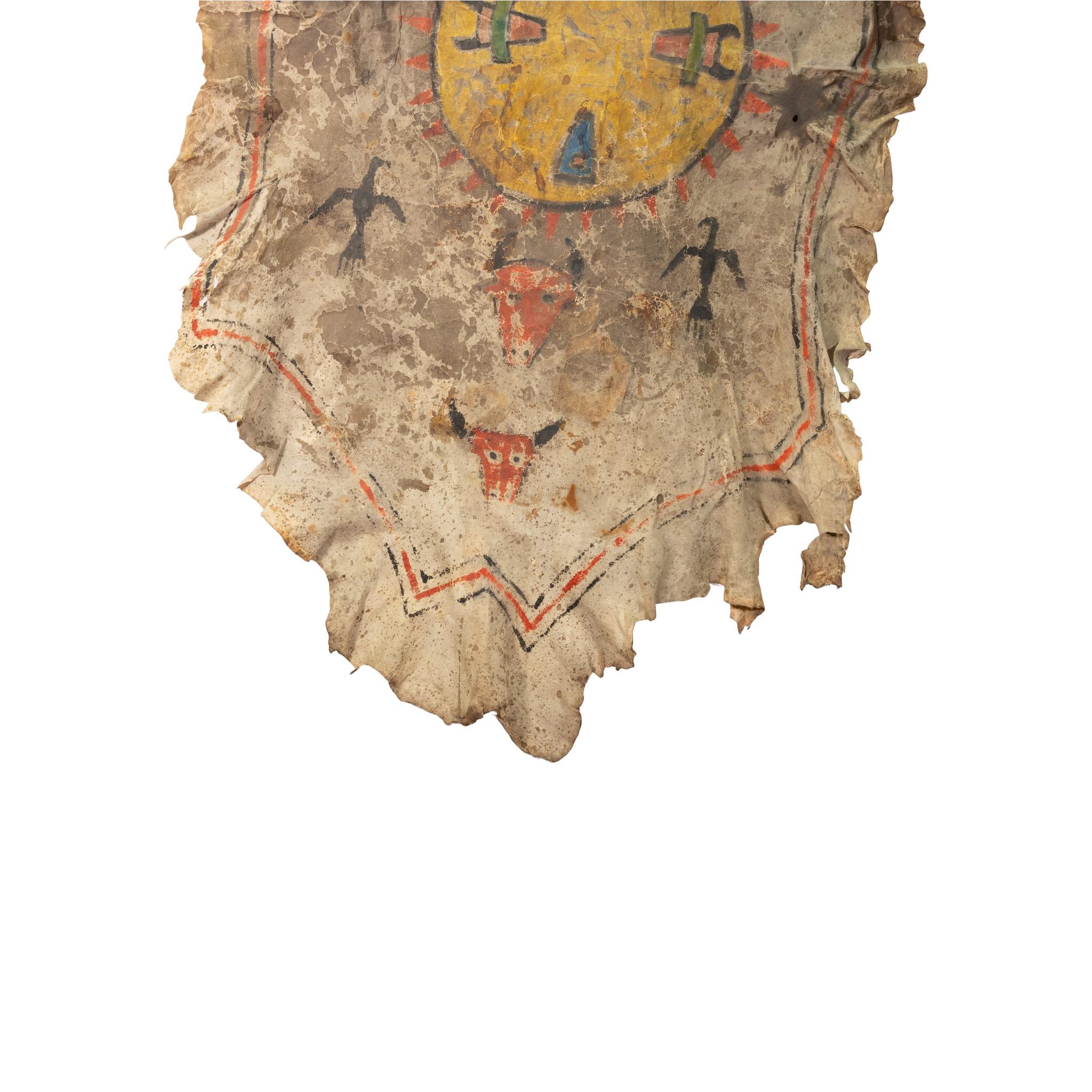 Northern Plains hide painting, buffalo society, pre-reservation. Two buffalo heads, two full body buffalos, two thunderbirds and buffalo sun shield in center. On brain tanned deer skin. Ex. Van Landingham

Period: Last half of the 19th