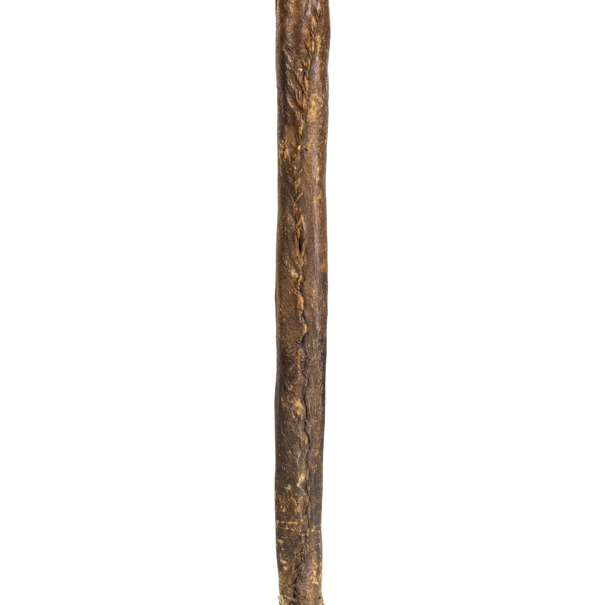 Northern Plains war club with stylized stone buffalo head. Raw hide wrapped adorned with brass tacks. Much patina from use, blood, grease and sweat. Museum quality.

Period: Mid-19th century
Origin: Northern Plains
Size: 26