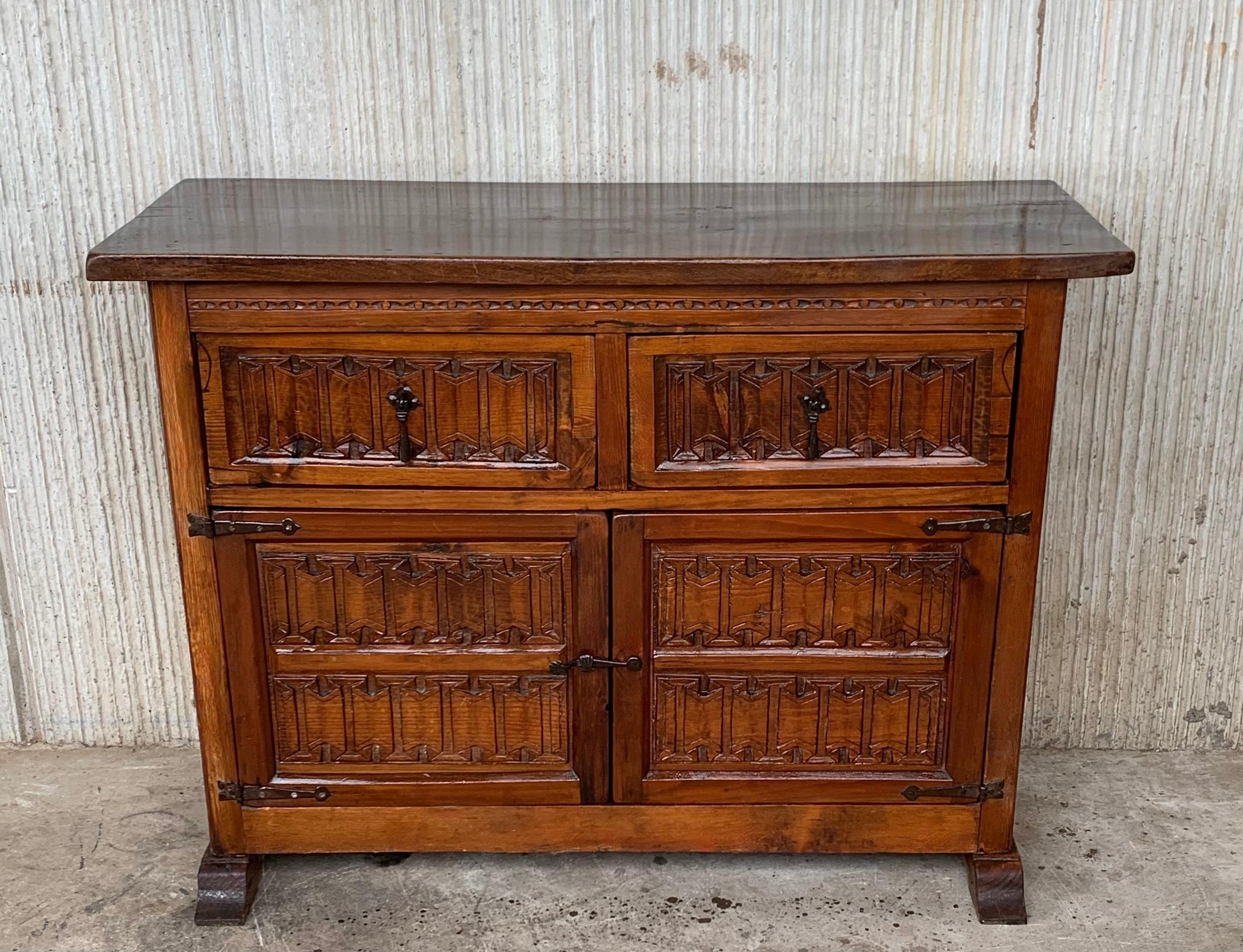 19th century Spanish carved pine cabinet or console with two drawers and two doors with original iron hardware.
You can use like a commode or chest of drawers
This elegant antique walnut console was crafted in Spain, circa 1900. The chest with
