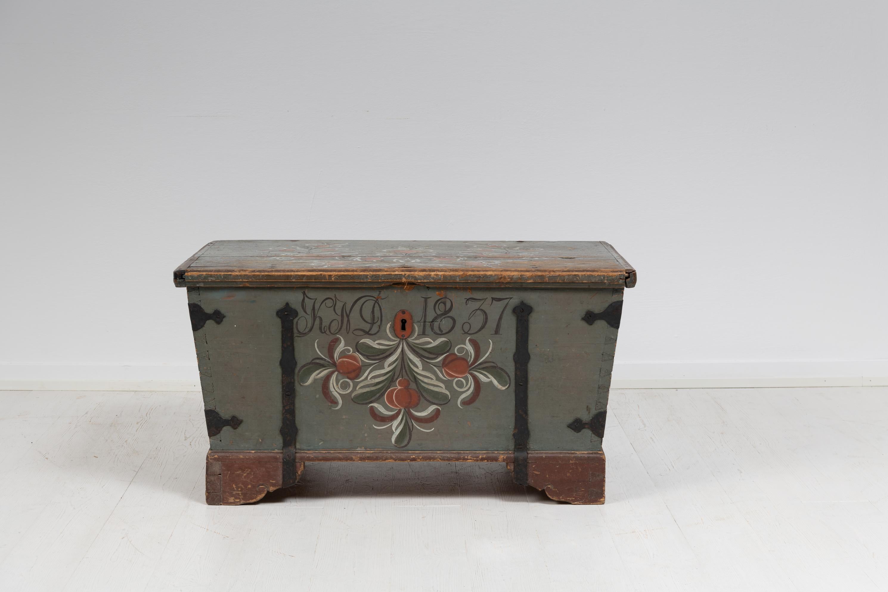 Original painted country chest dated 1837. The chest also has painted initials KND where the D stands for Dotter, meaning daughter. At the time last names where not inherited but made up of the father first name and with the suffix -son for sons or