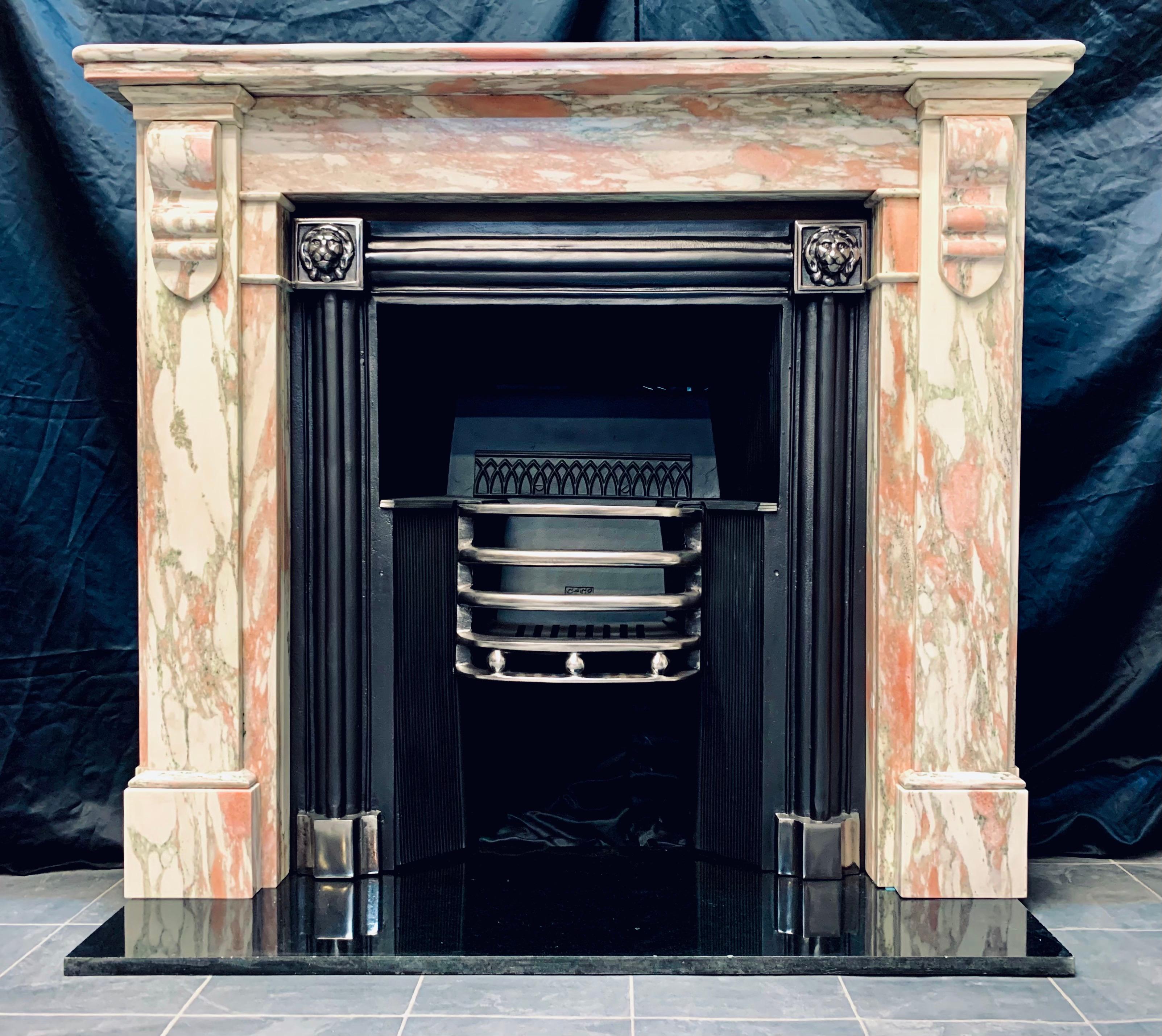 A rare 19th century Corbeled fireplace surround in the Georgian manner carved from Breche Rossa Norvegia marble (Norway) 
A bullnose top shelf with a secondary under shelf, sits above an unadorned frieze, flanked in turn by a pair of jambs. The