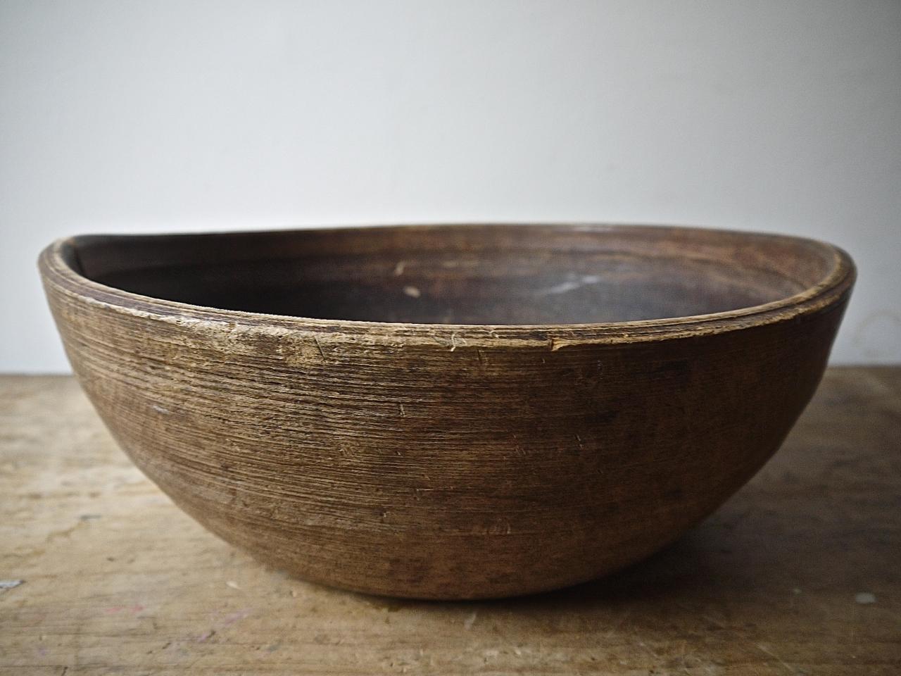 19th century Norwegian carved wooden bowl has a lovely worn and used feel and look.