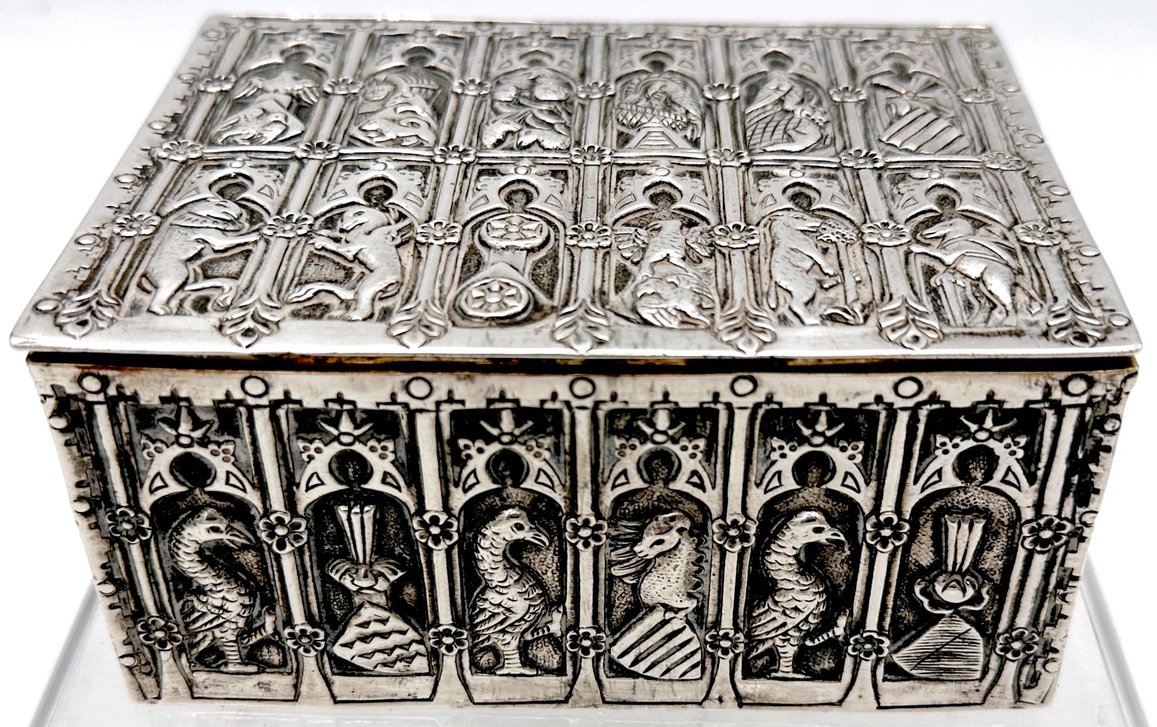 Renaissance-Style German Silver Box with Heraldic and Architectural Reliefs, Nuremberg, 19th Century

Weighing approximately 13 ounces and measuring 5 inches wide by 3.75 inches deep and 2.25 inches high, this finely cast and richly detailed silver