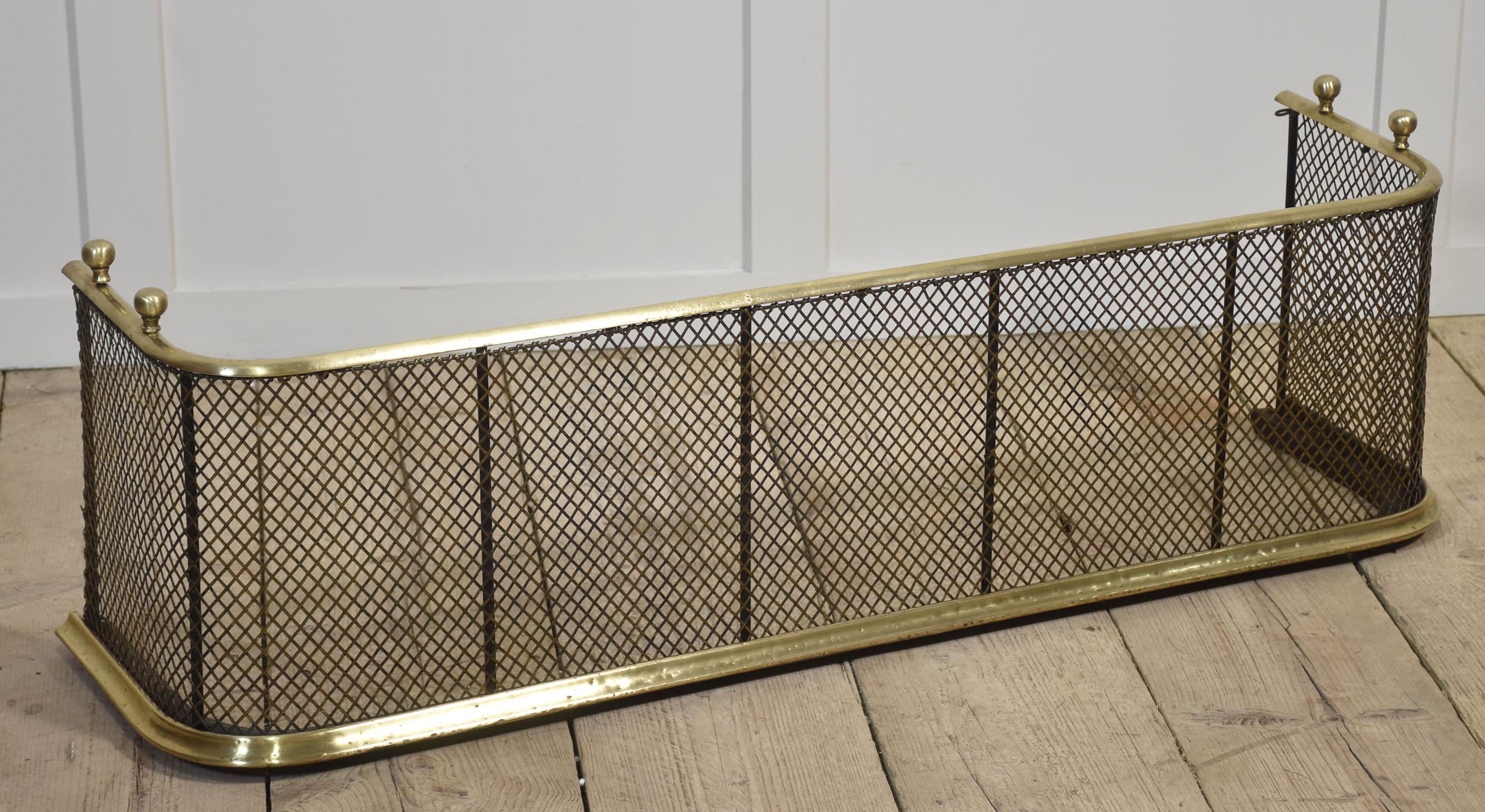 Nursery guard with brass top rail with shaped end returns over wrought iron supports and iron meshing.
Dimensions
Height 14 Inches
Width 45 Inches
Depth 12.5 Inches