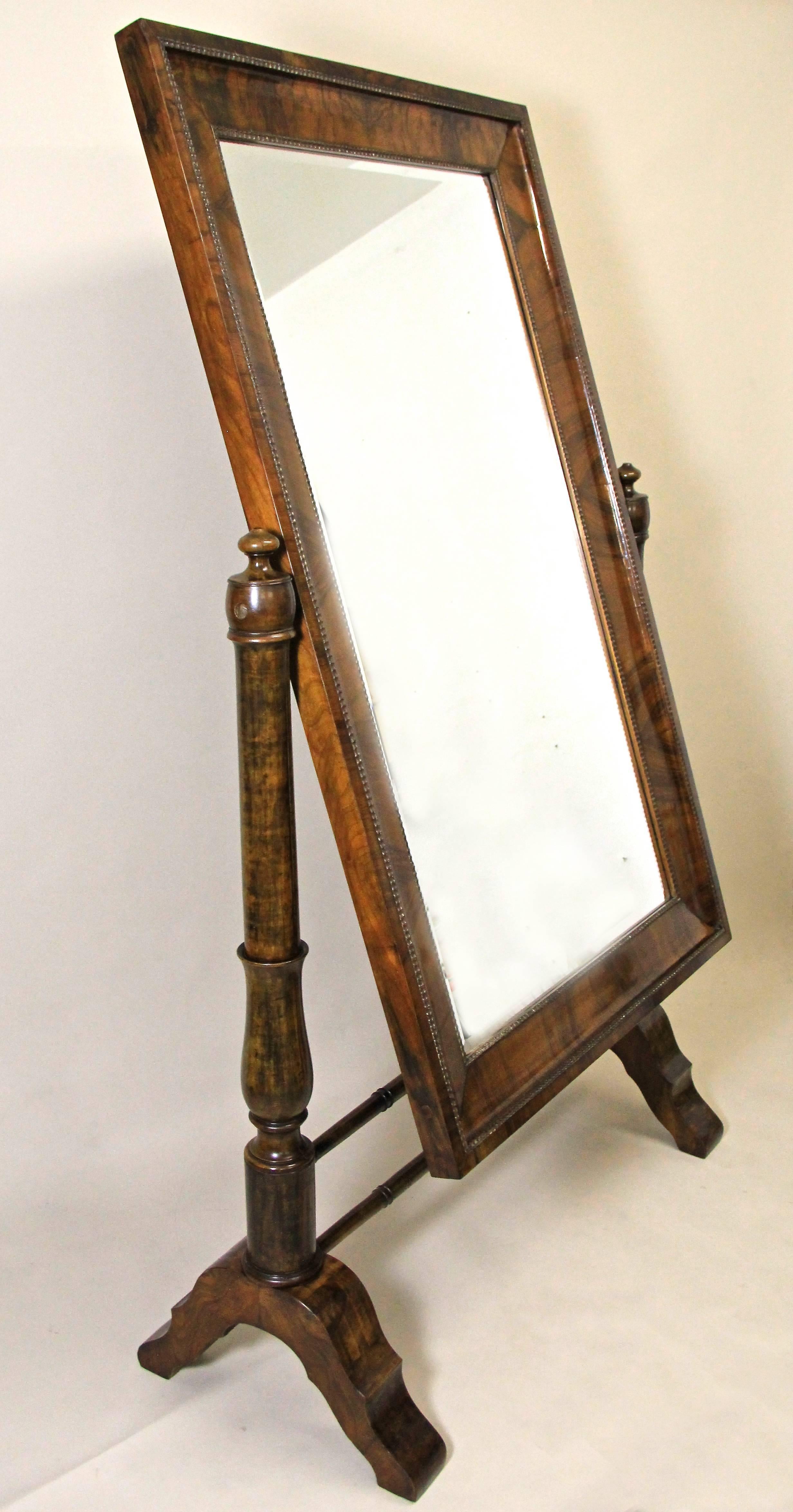 Gorgeous large 19th century nutwood Cheval mirror from the early Biedermeier era circa 1825 in Vienna/ Austria, one of the world's epicenter of this famous period. Impressing with its dreamlike original condition - only the facet-cut mirror had to