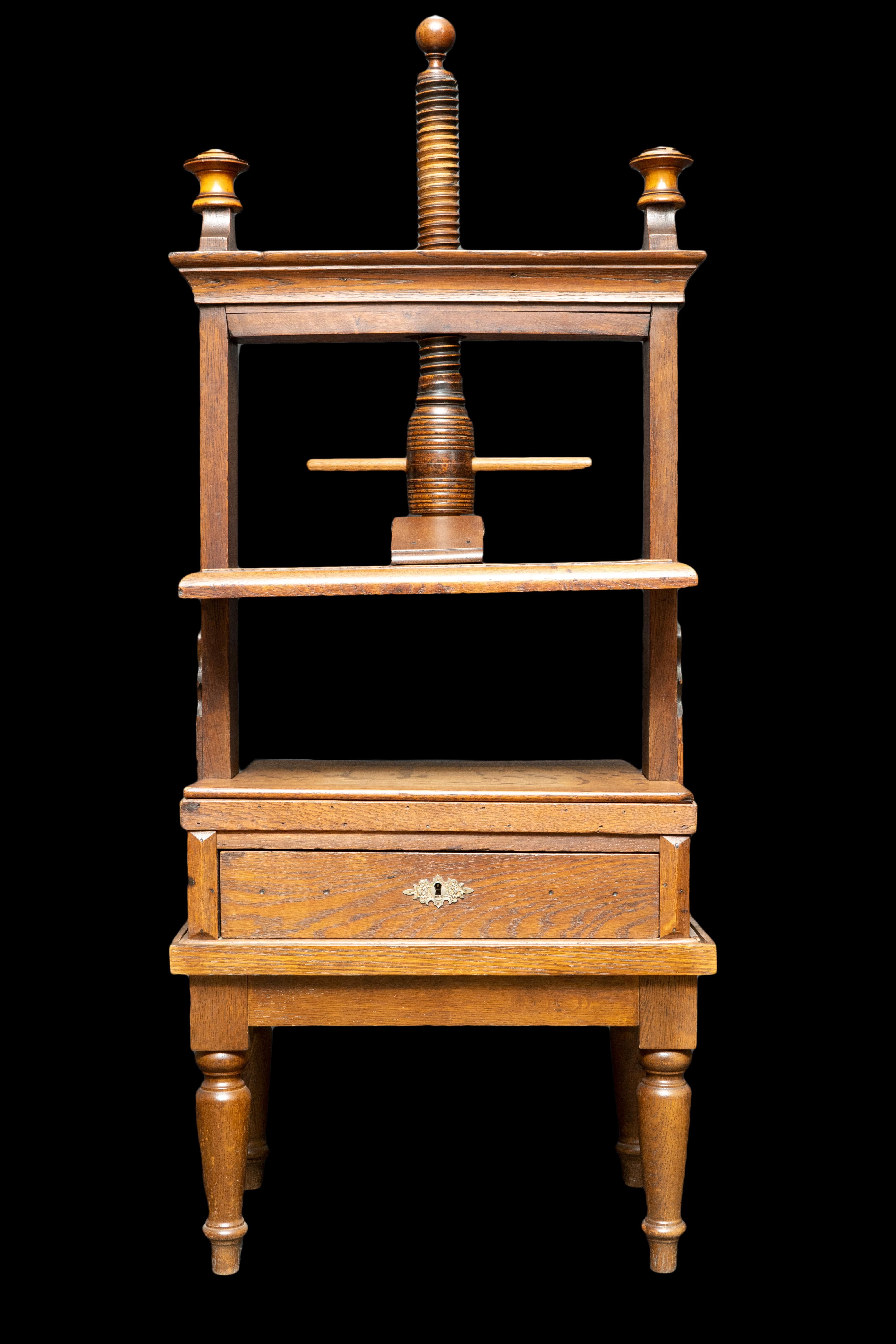 19th century oak book press:

Measures: 15.5