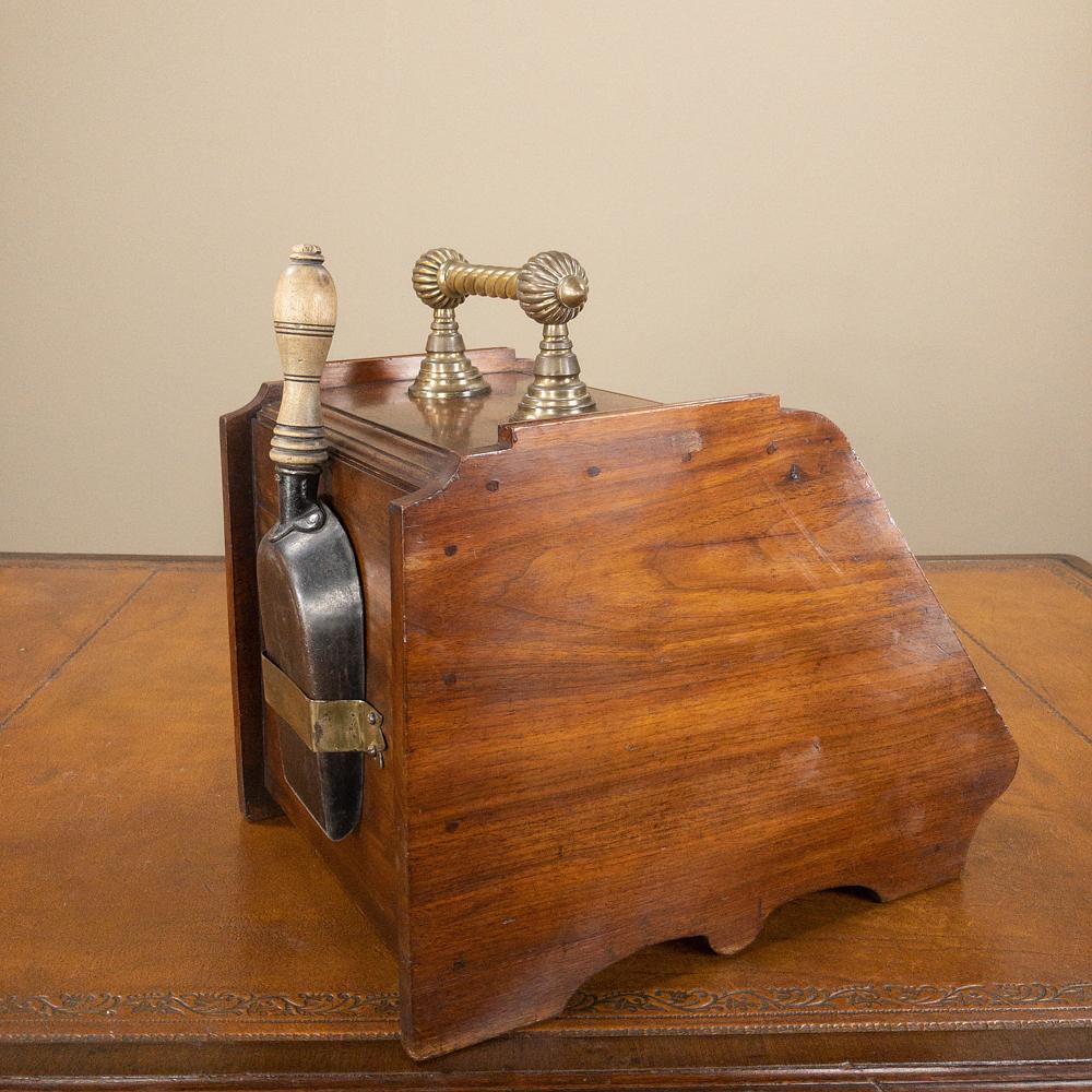 19th century oak & brass coal scuttle was hand-crafted from embossed brass depicting peaches ready for picking, then fitted into the oaken frame, all designed to be used multiple times a day, all winter long! Perfect as an accent piece for your