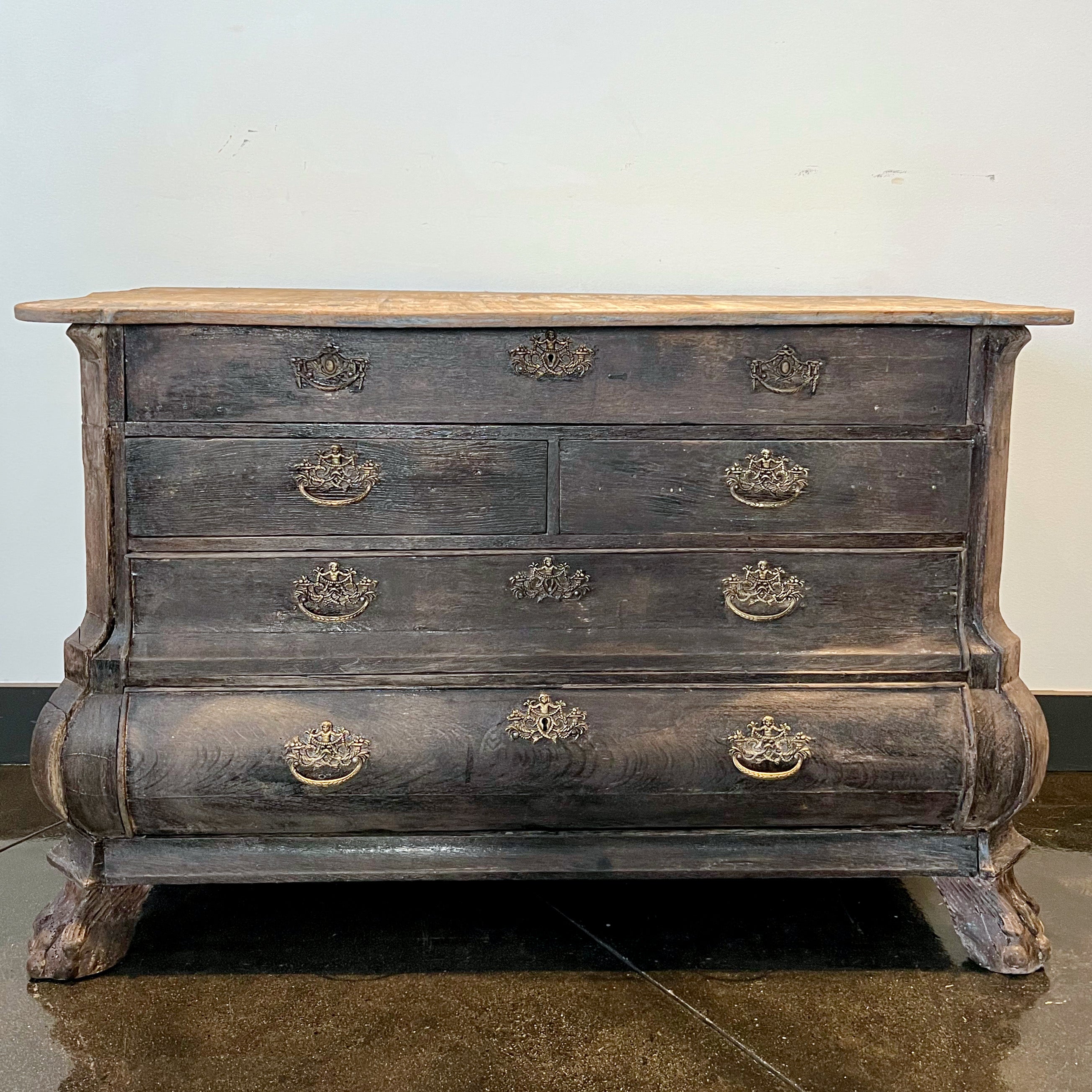 A charming small bombe front Dutch commode in old stained oak with five drawers and beautiful original bronze hardwares. 
Nederland, circa 1840 
More than ever, we selected the best, the rarest, the unusual, the spectacular, the most charming what