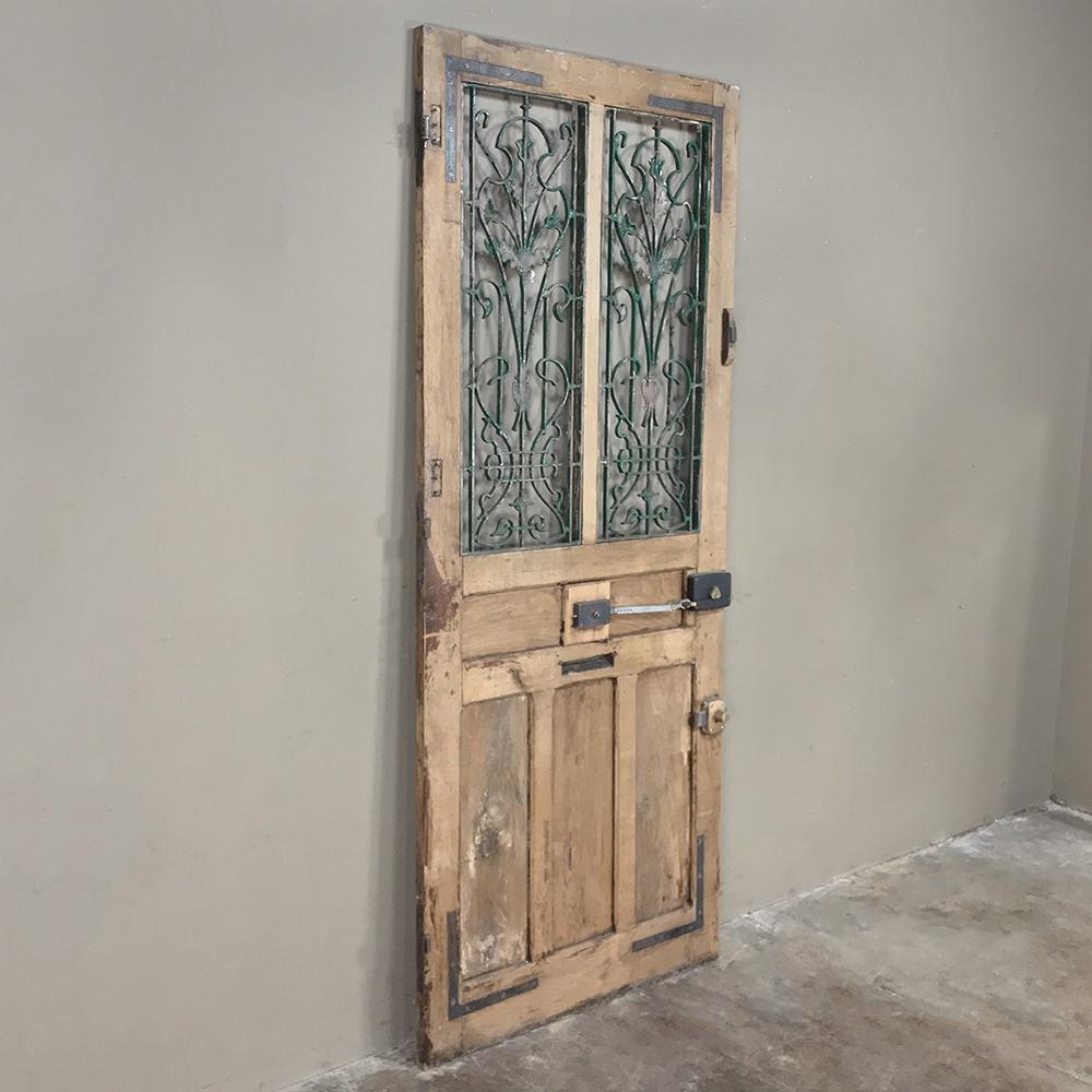 French 19th Century Oak Entry Door with Wrought Iron